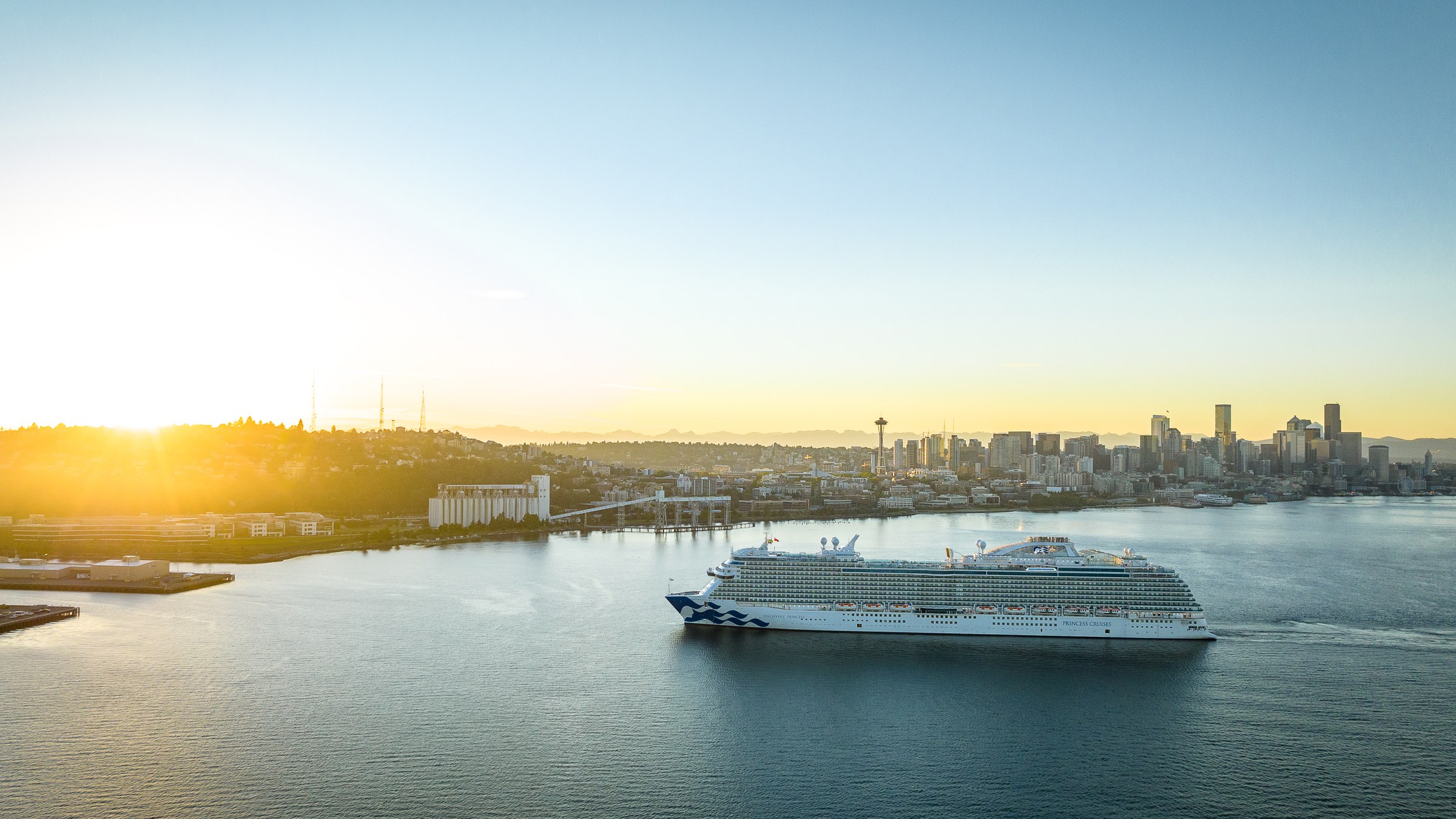 Discovery Princess sailing Elliott Bay near Seattle at golden hour