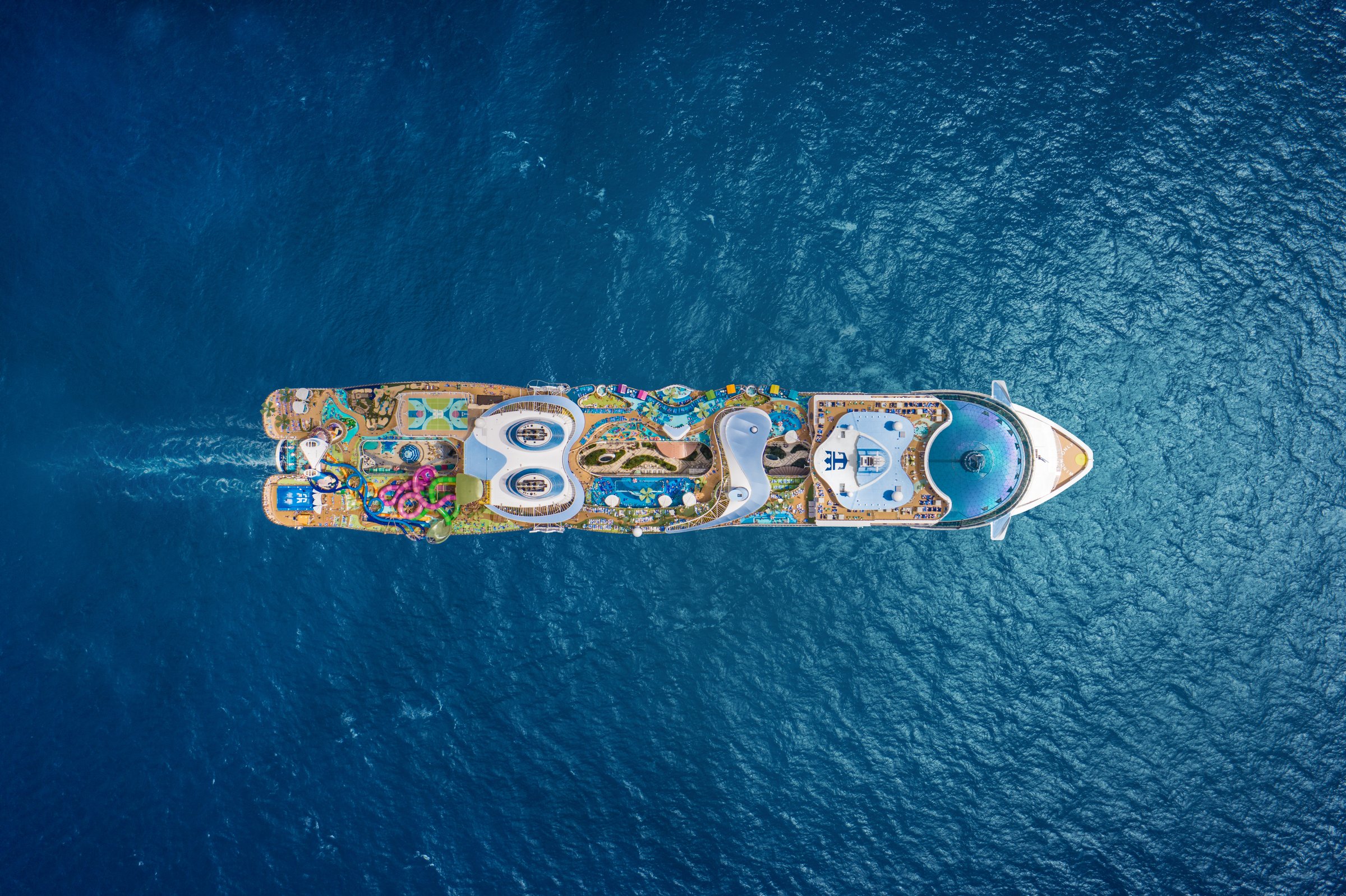 Royal Caribbean’s Icon of the Seas sailing across a deep-blue sea