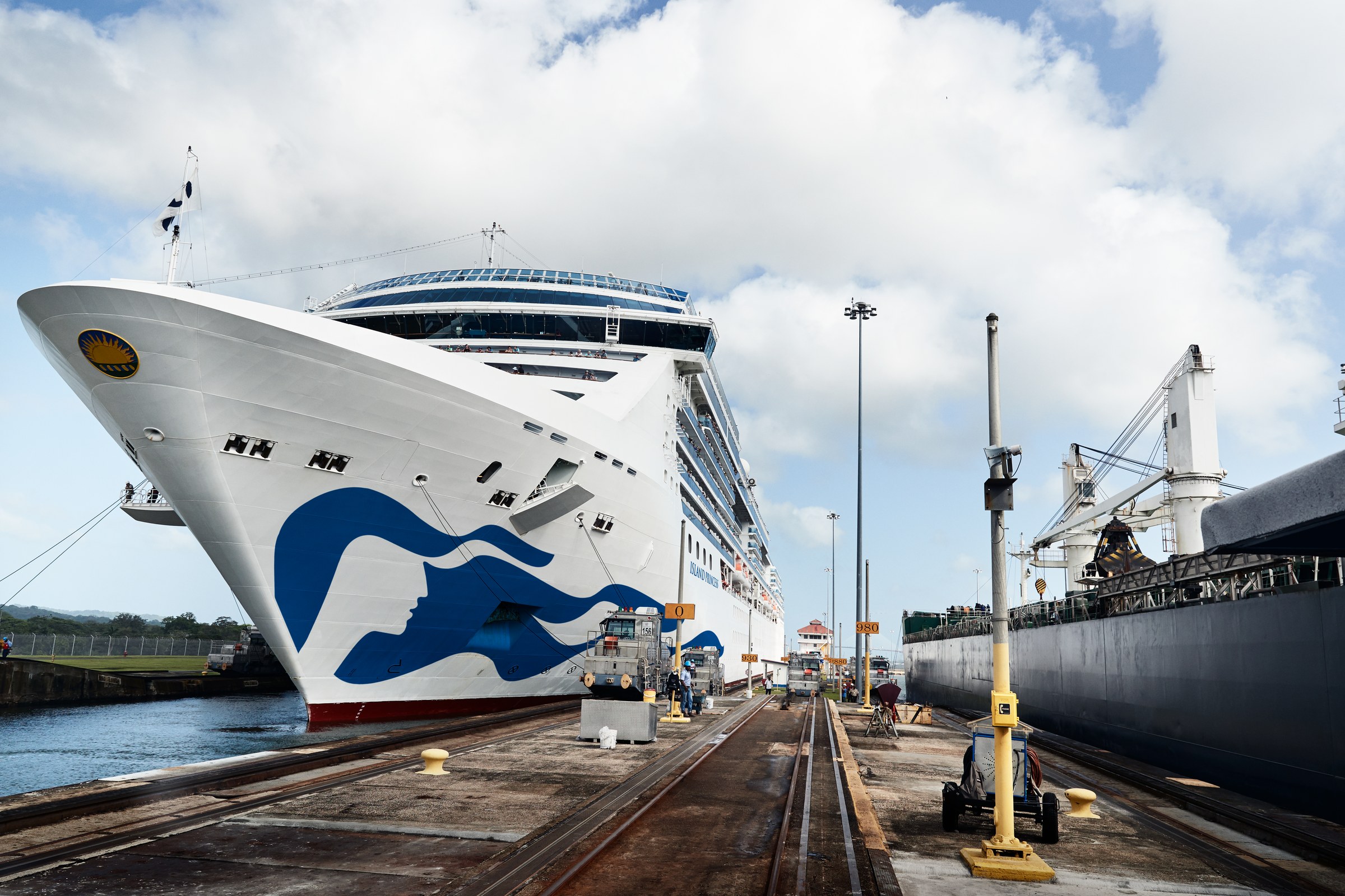 Island Princess bow in a Panama Canal lock under a bright sky
