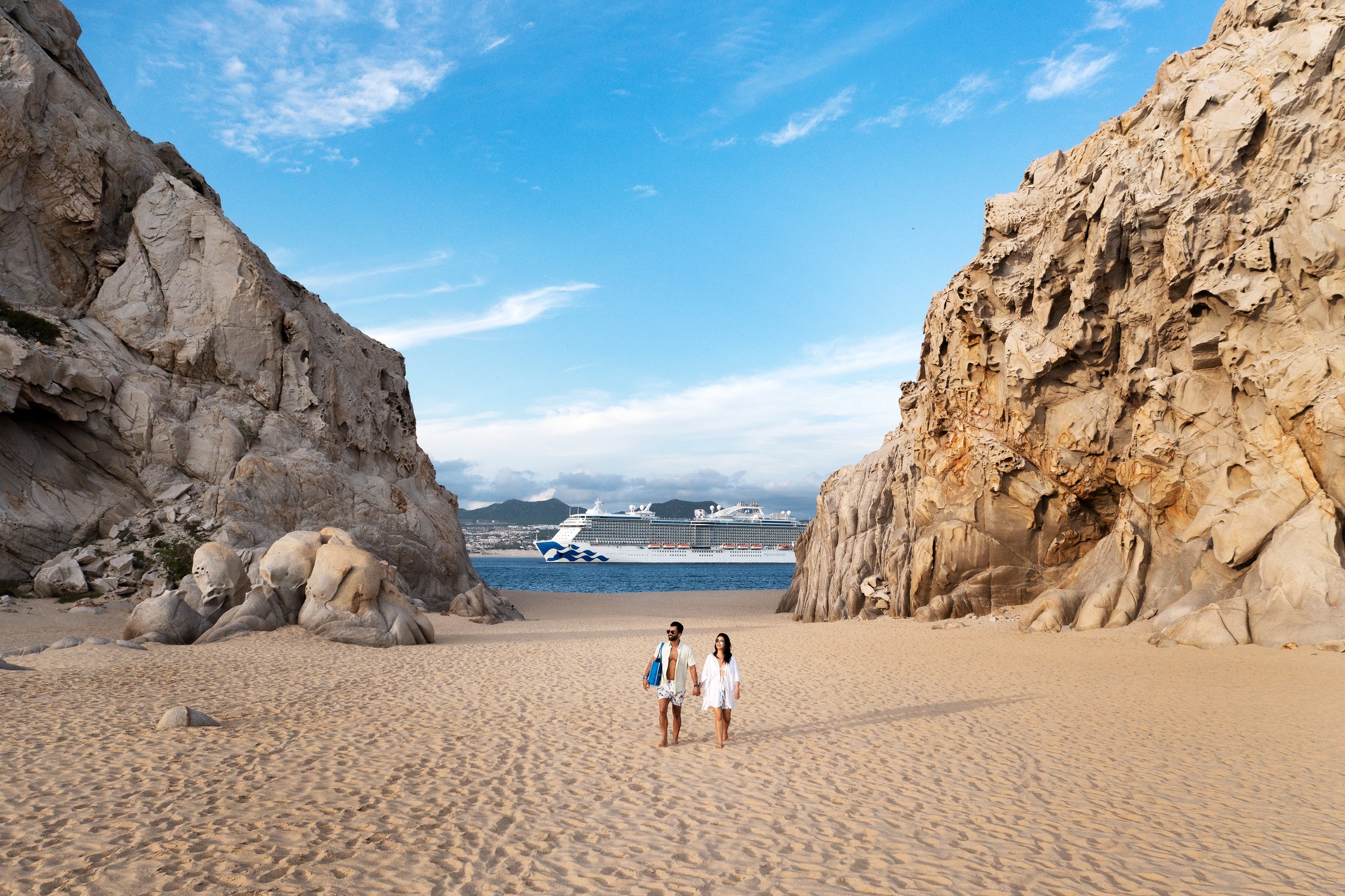 Majestic Princess beyond Cabo San Lucas arch and beach on a sunny day
