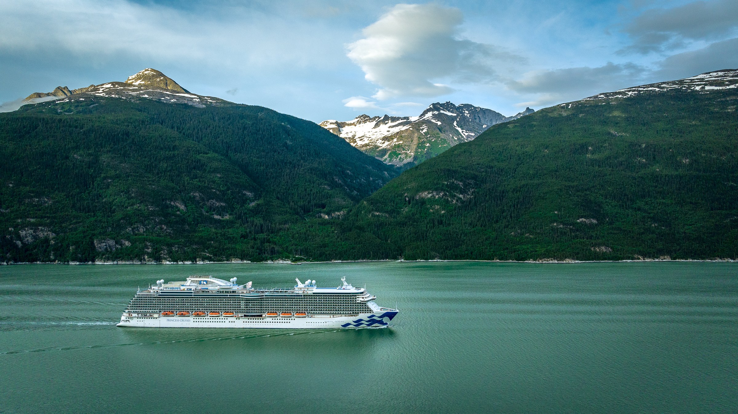 Majestic Princess profile against snowy Alaskan mountains