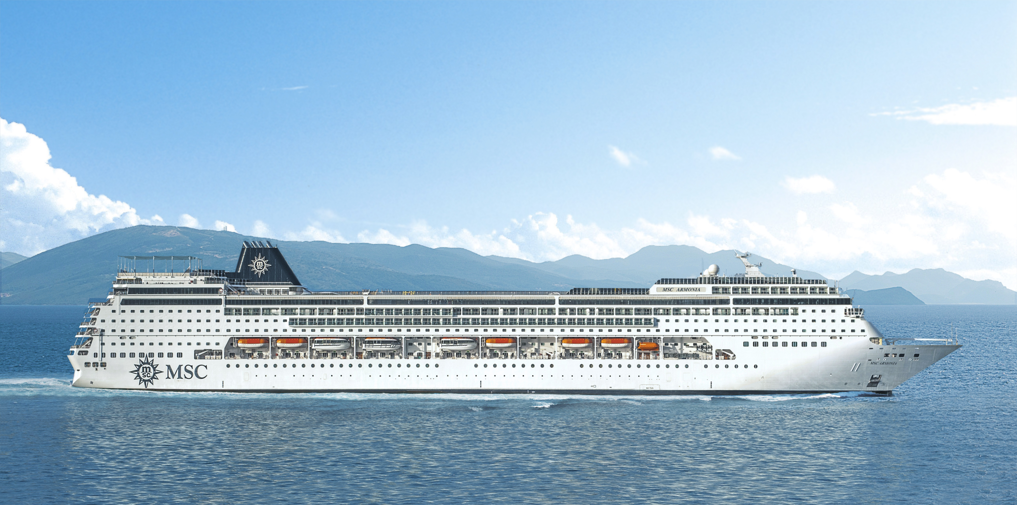 MSC Armonia sunny profile exterior underway with ARMONIA on the bow