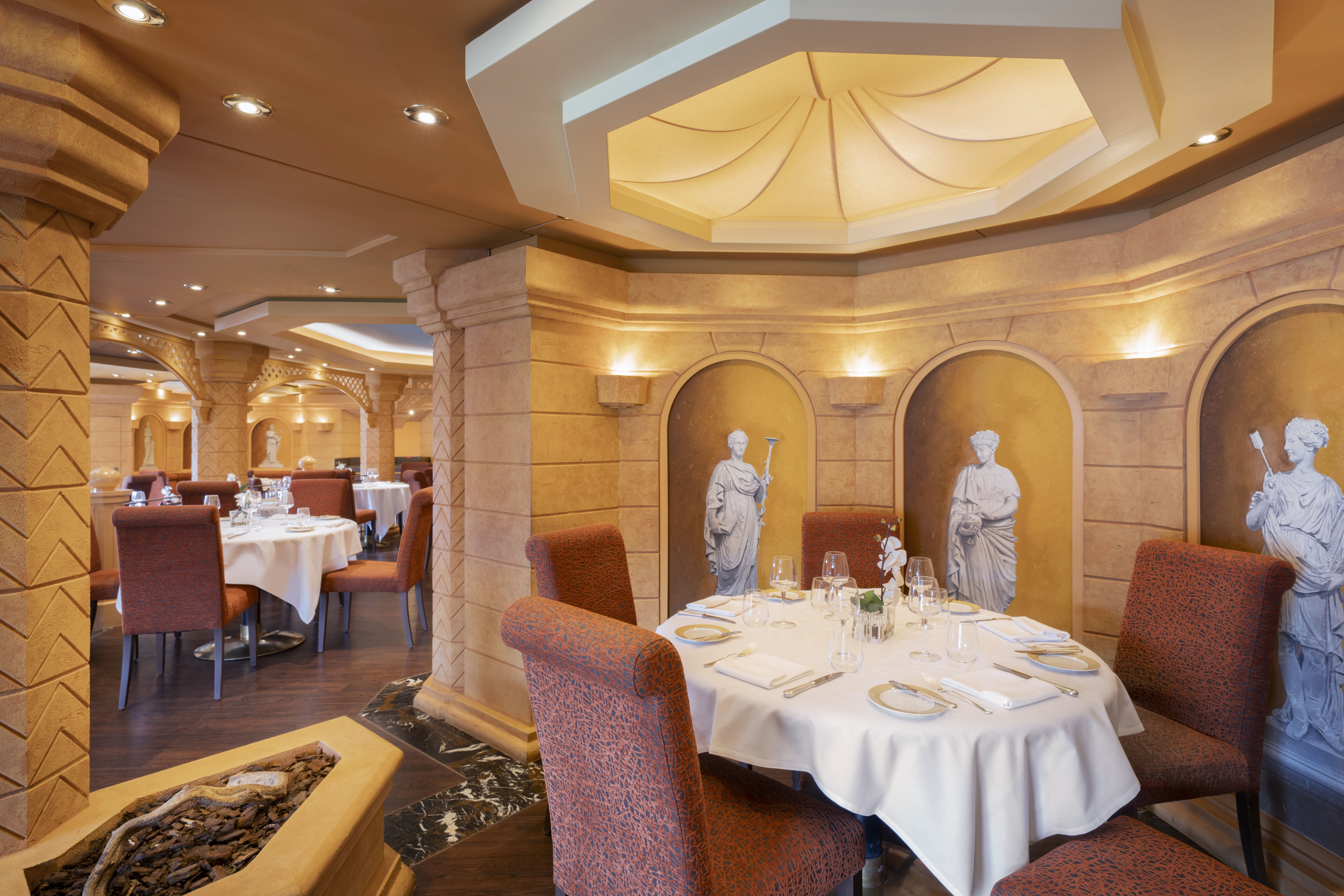 MSC Divina Le Muse restaurant dining room in warm daylight