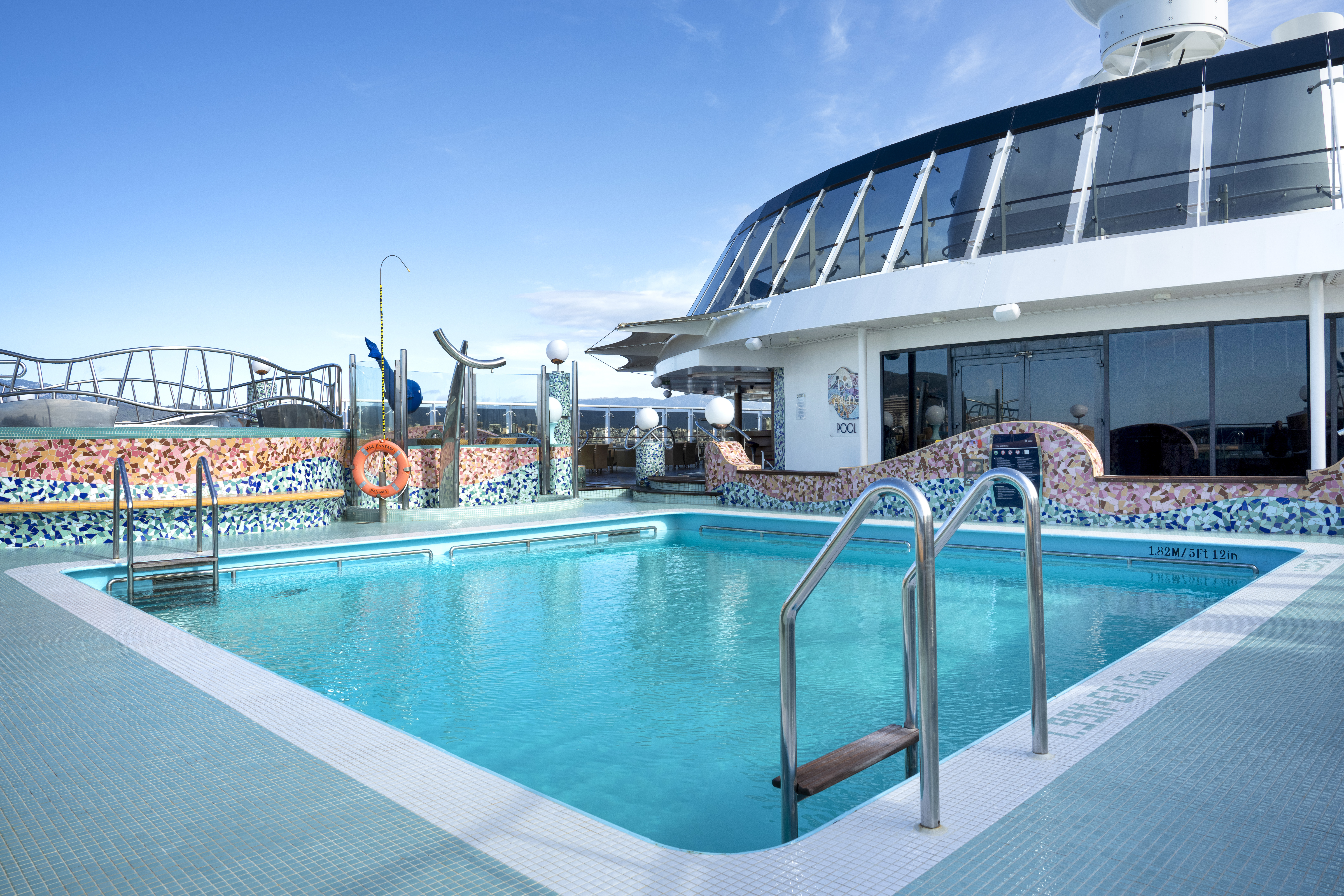 MSC Fantasia Lido Catalano pool with mosaic wall and loungers