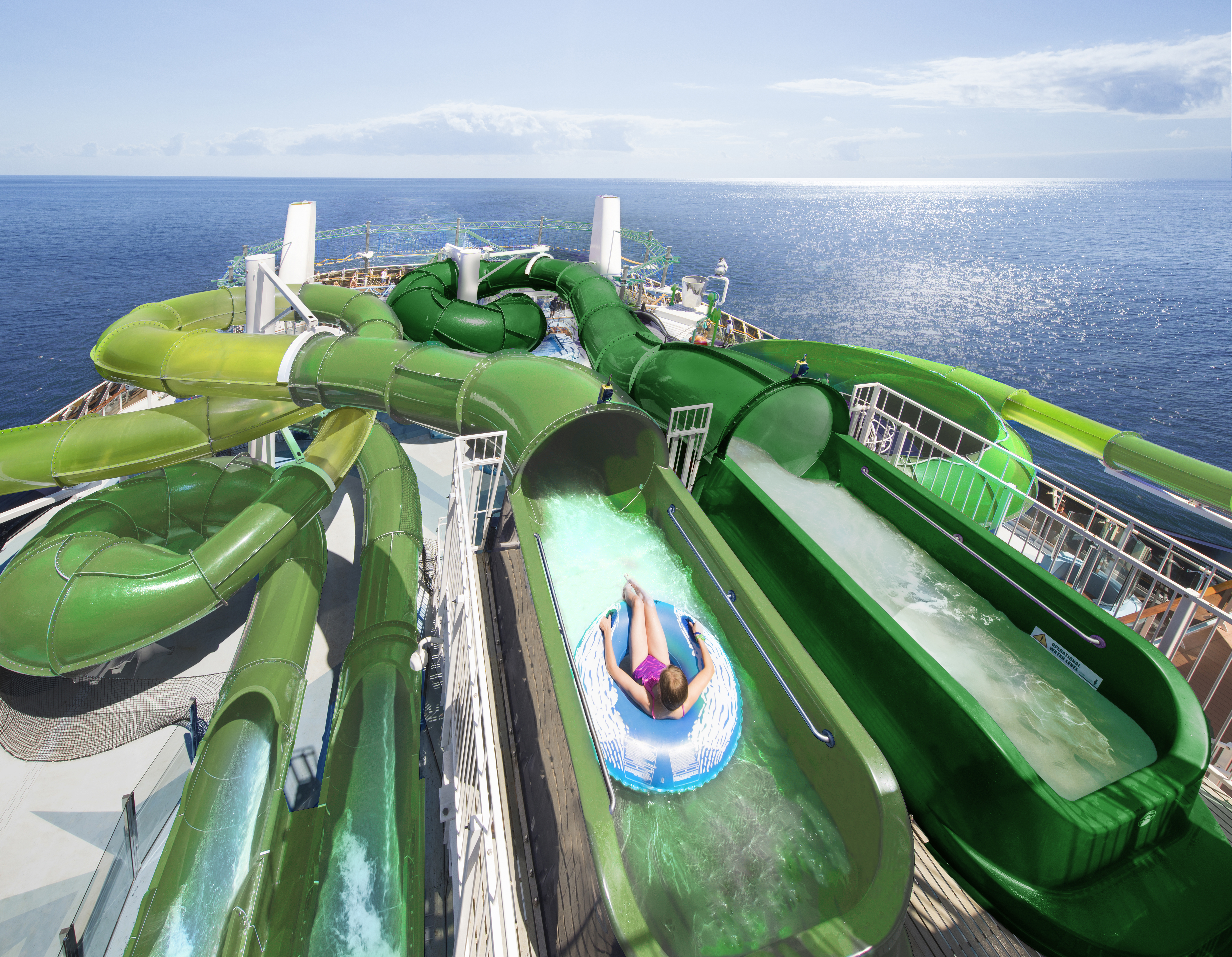 MSC Grandiosa Wild Forest Aquapark green slides above the ocean