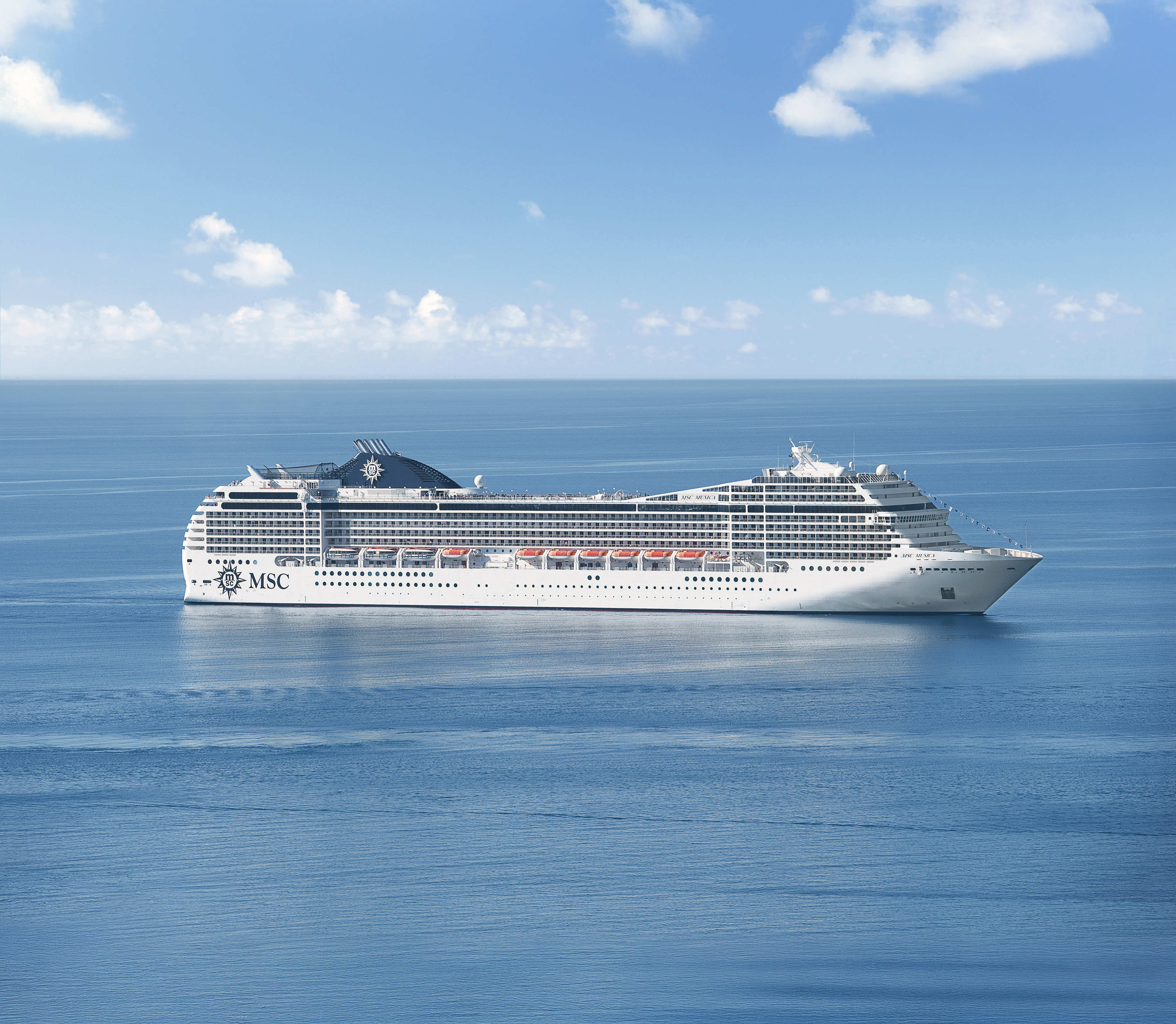 MSC Musica sailing at sea under clear midday sky