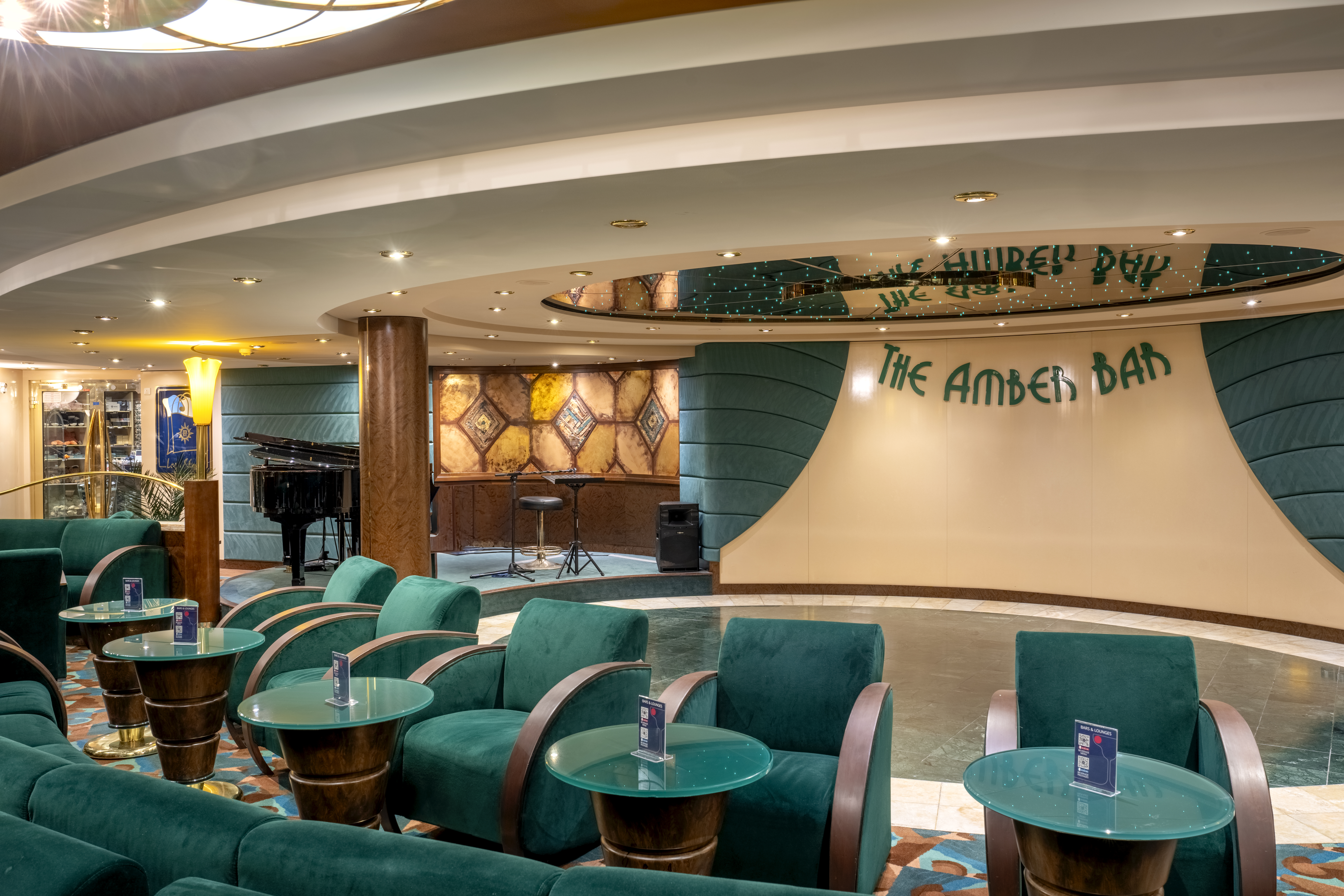MSC Orchestra The Amber Bar lounge with teal seating and stage
