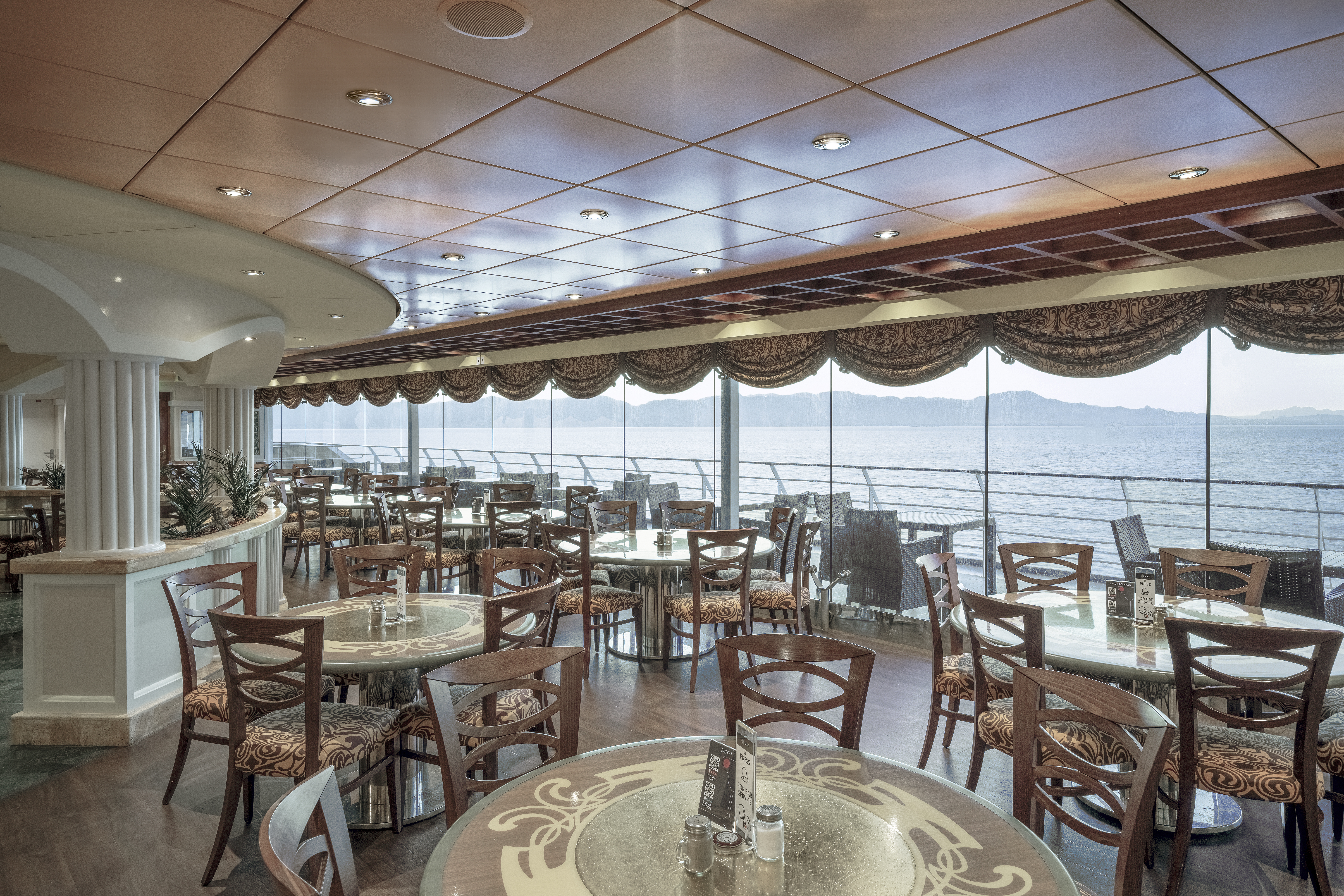 MSC Orchestra Buffet La Piazzetta dining room with daylight sea view