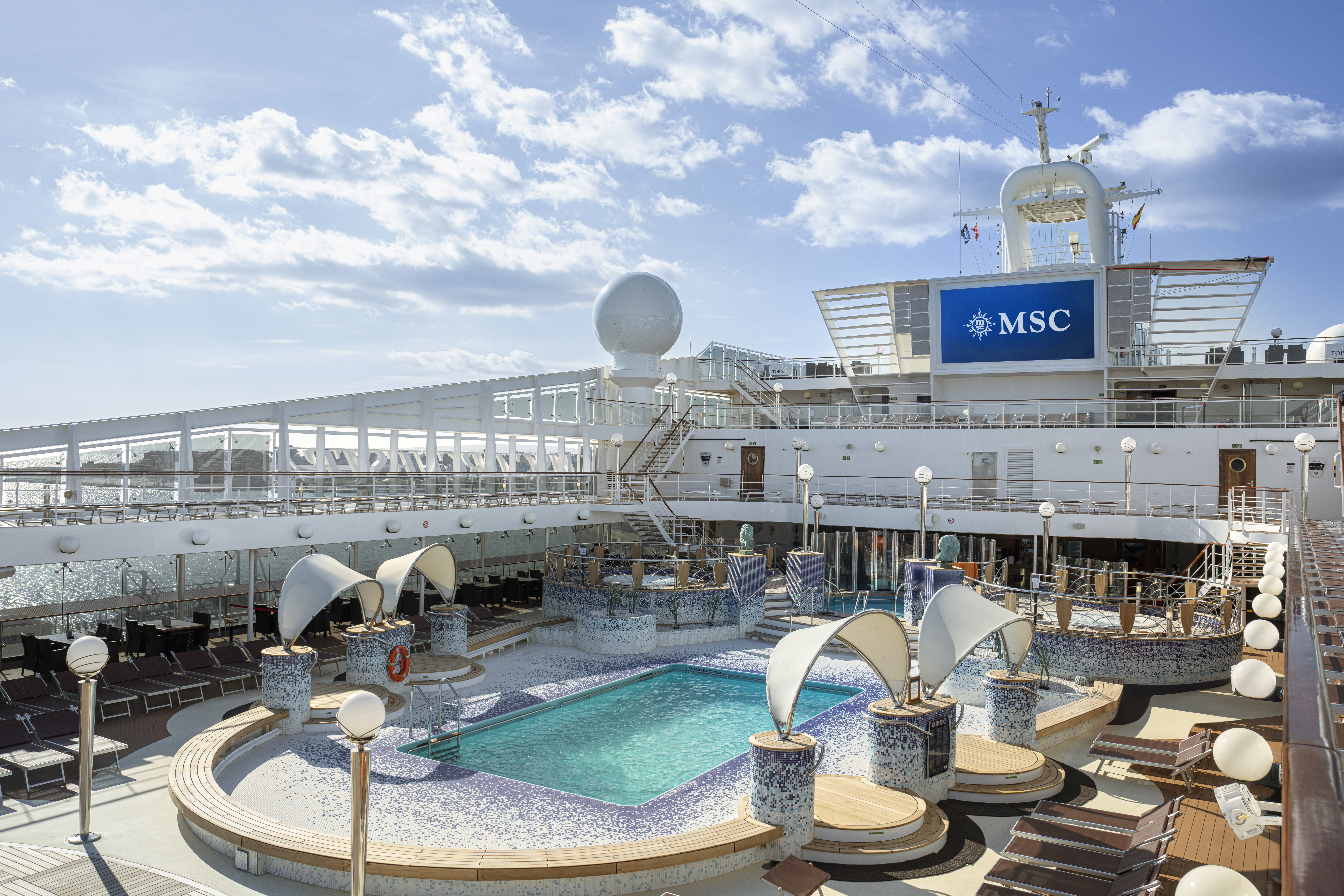 MSC Orchestra Acapulco pool deck with sail sunshades in bright sun