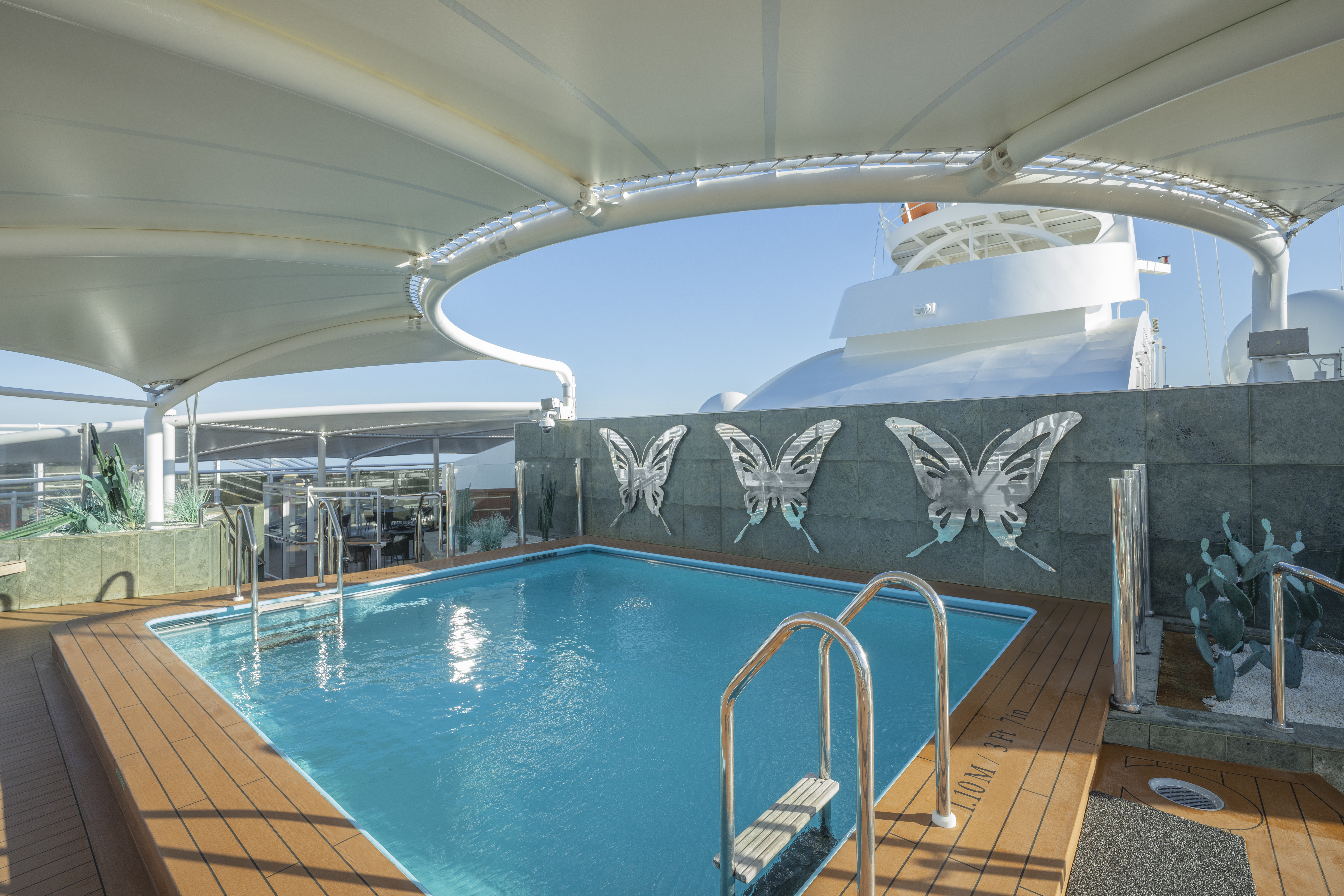 MSC Preziosa Yacht Club The One Pool under a white canopy