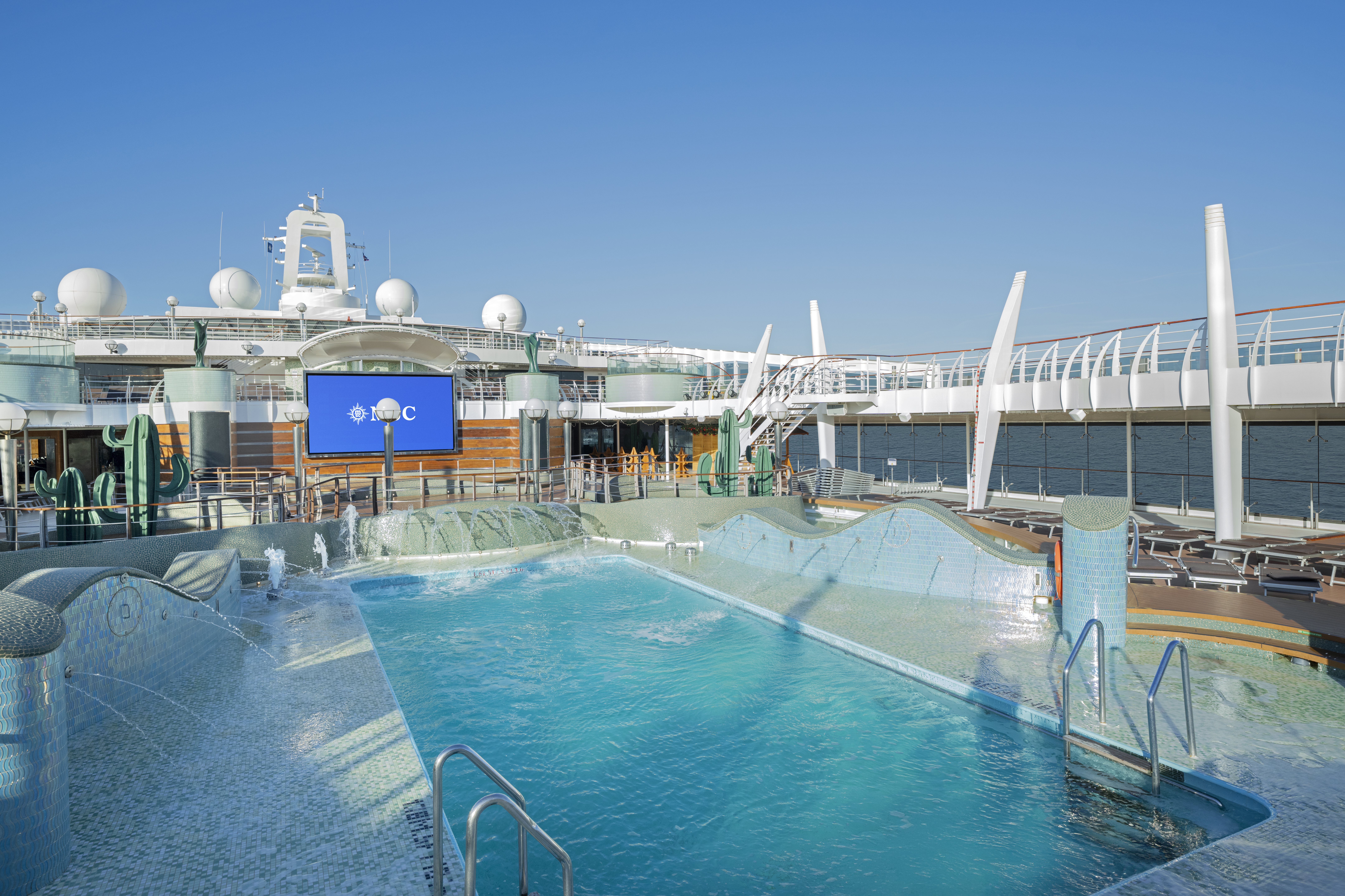 MSC Preziosa Acqua Park pool deck with water features in bright sun