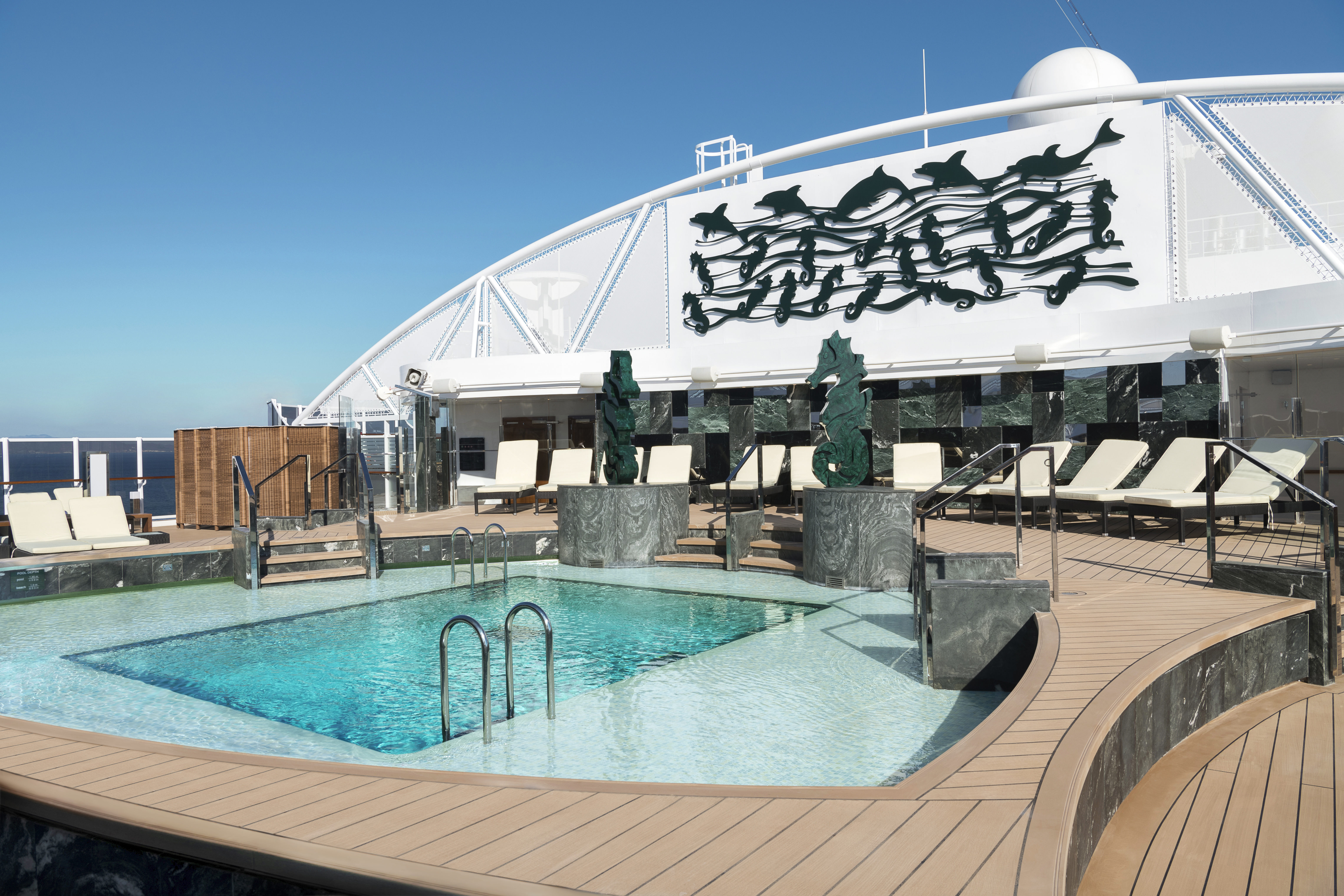 MSC Seaside Yacht Club Pool with seahorse sculptures on a sunny day