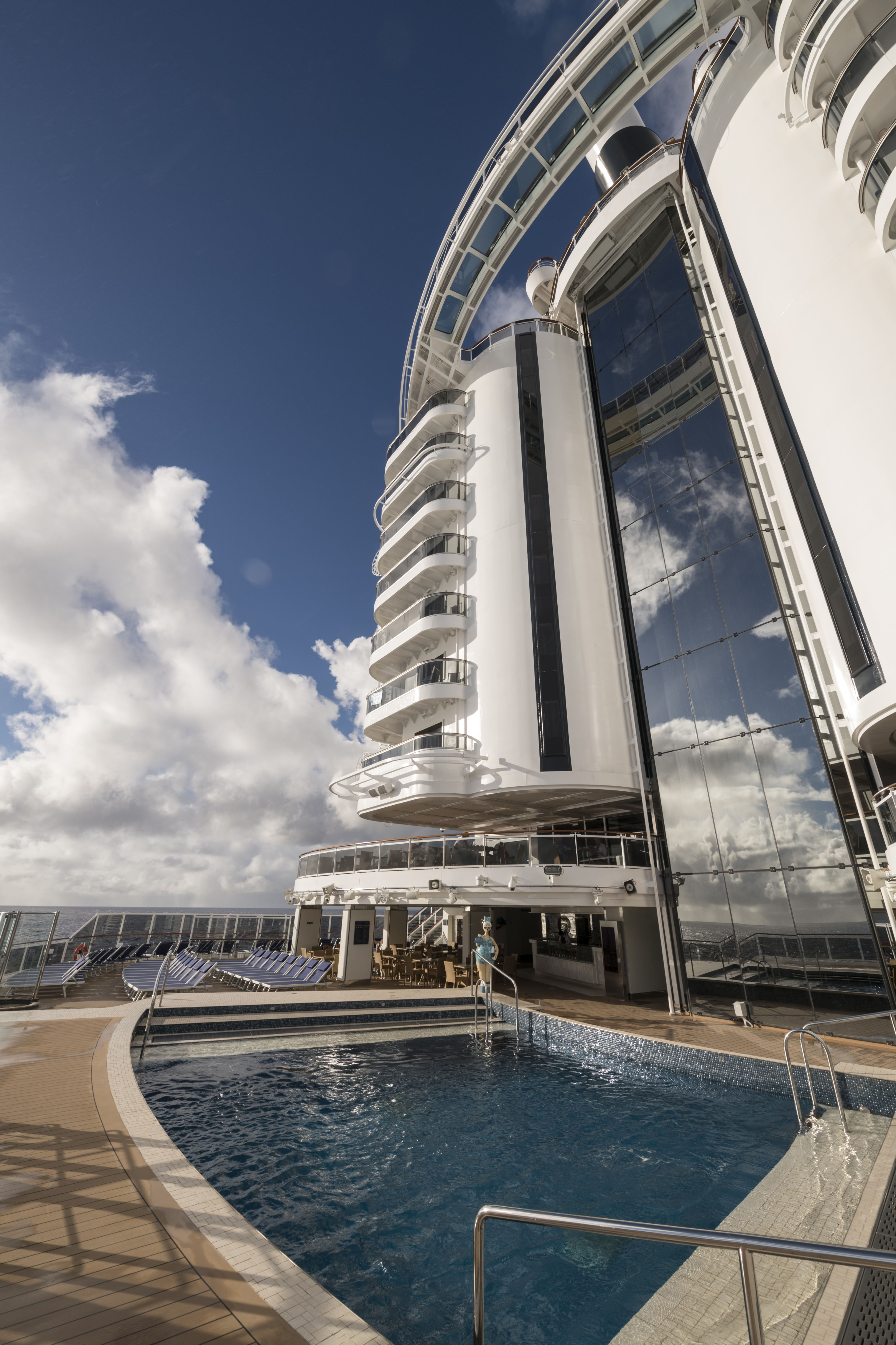 MSC Seaside South Beach Pool with balcony tower under blue sky