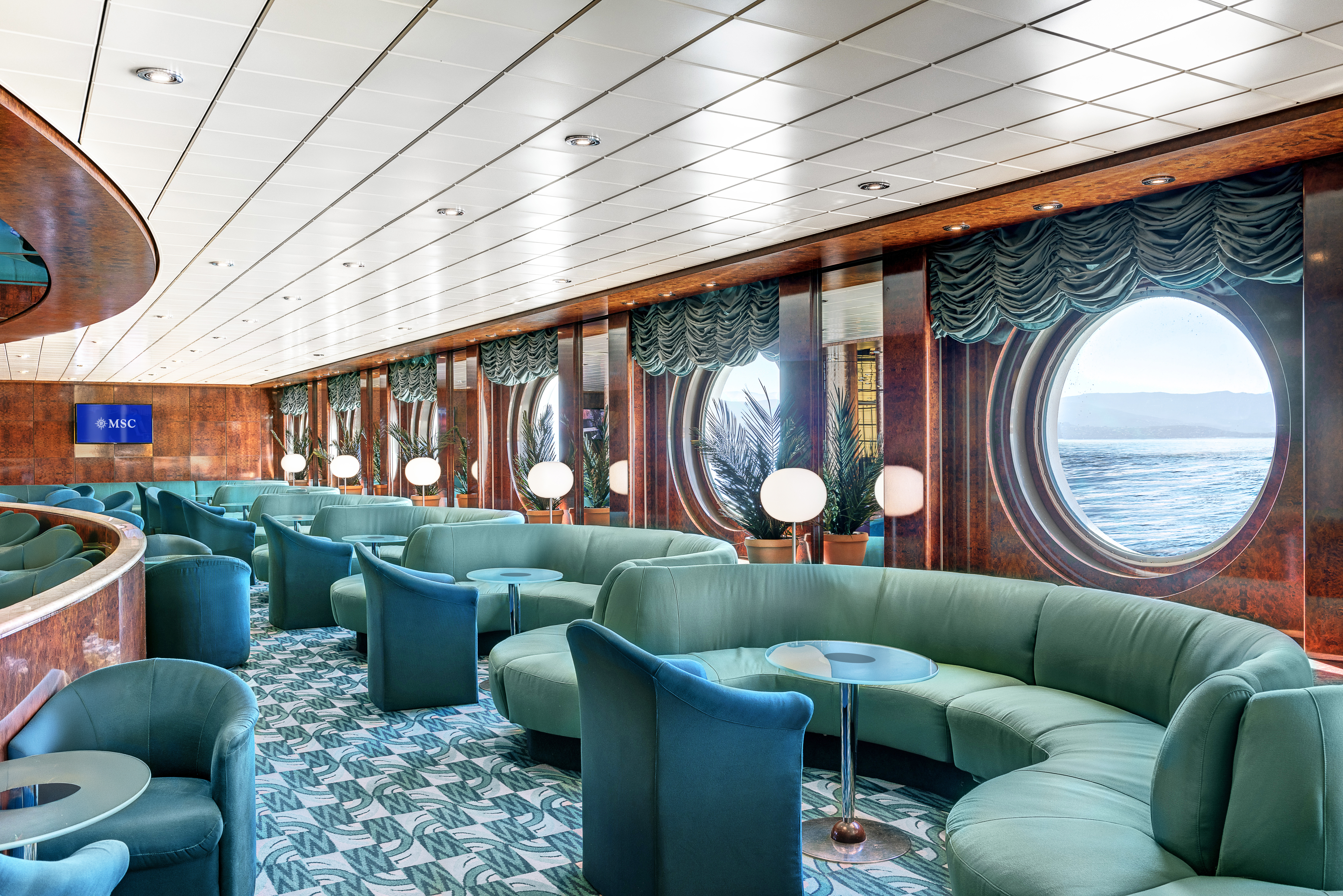 MSC Sinfonia Manhattan Bar with ocean portholes