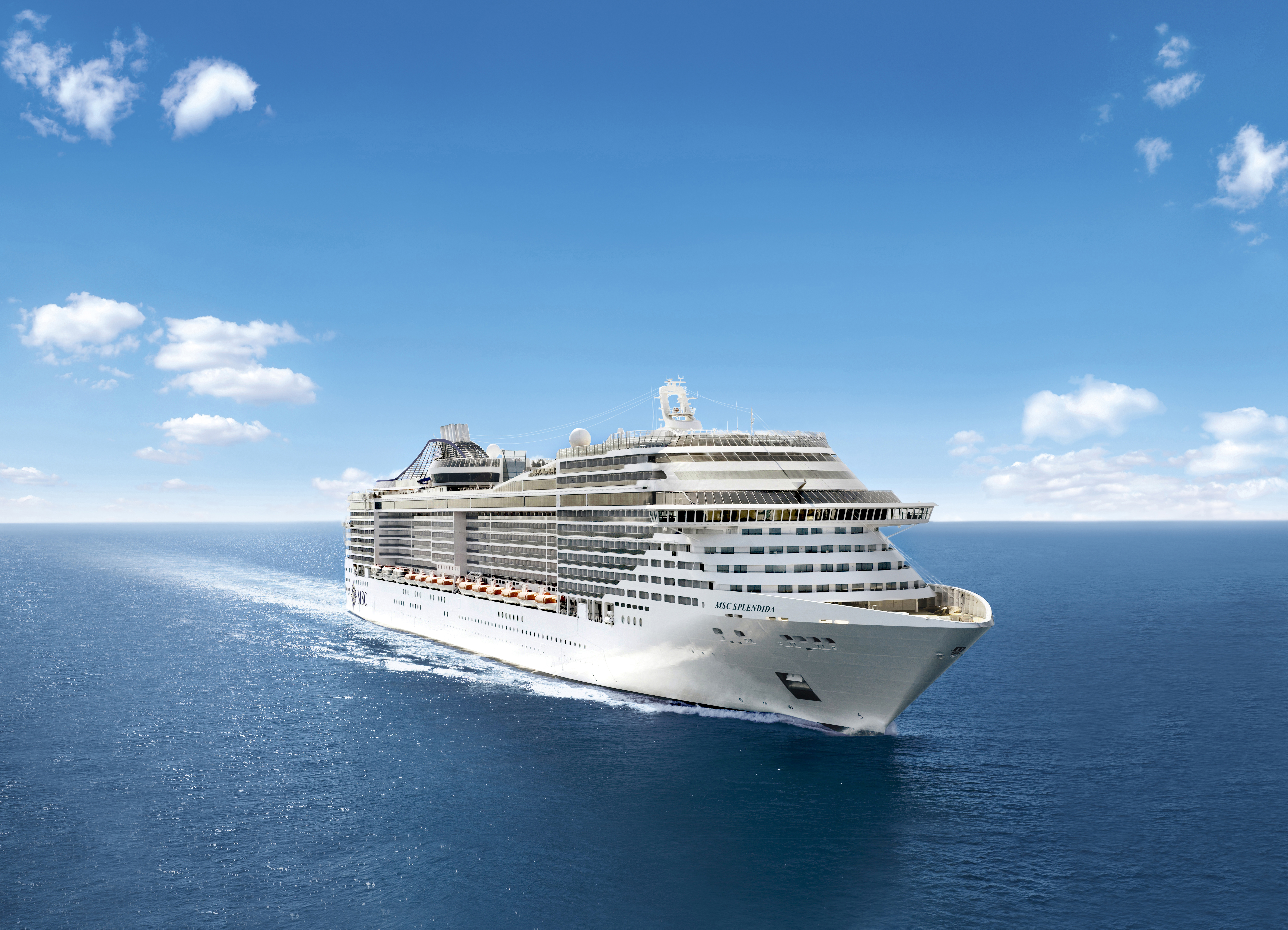 MSC Splendida starboard aerial underway under a clear blue sky