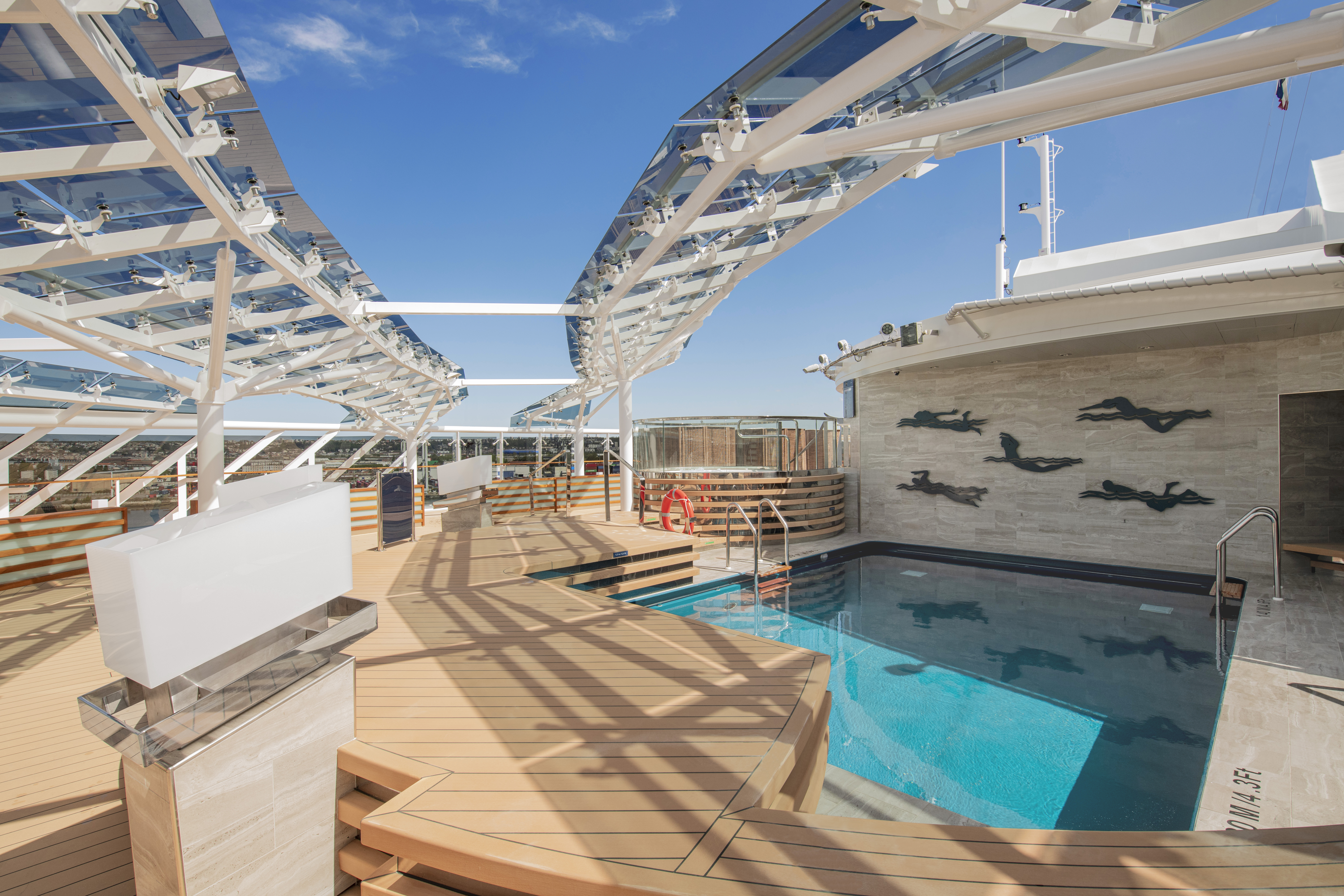 MSC Virtuosa Yacht Club Pool under blue glass canopy