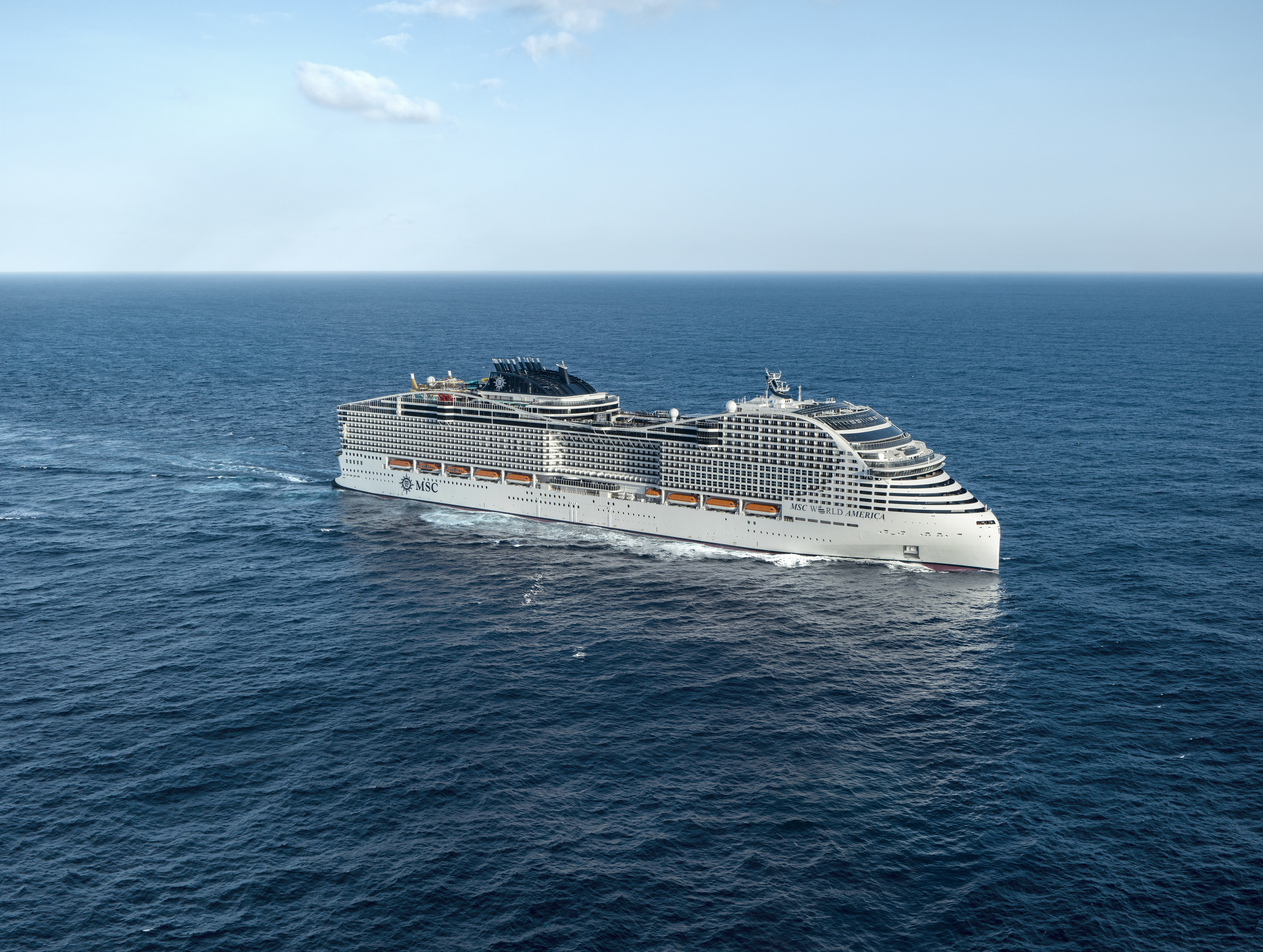 MSC World America starboard aerial underway under clear sky
