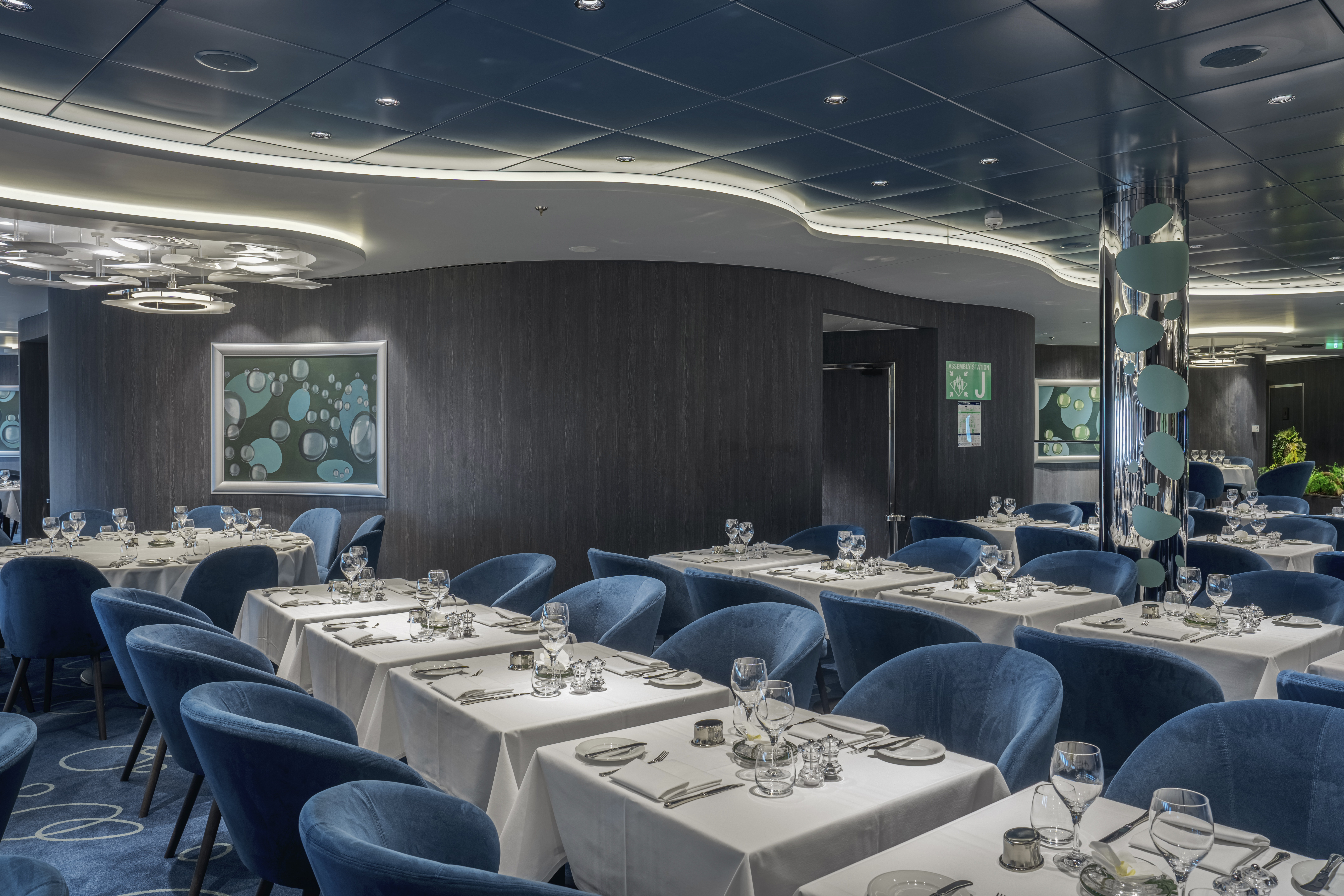 MSC World Asia Bubbles Restaurant dining room set for service