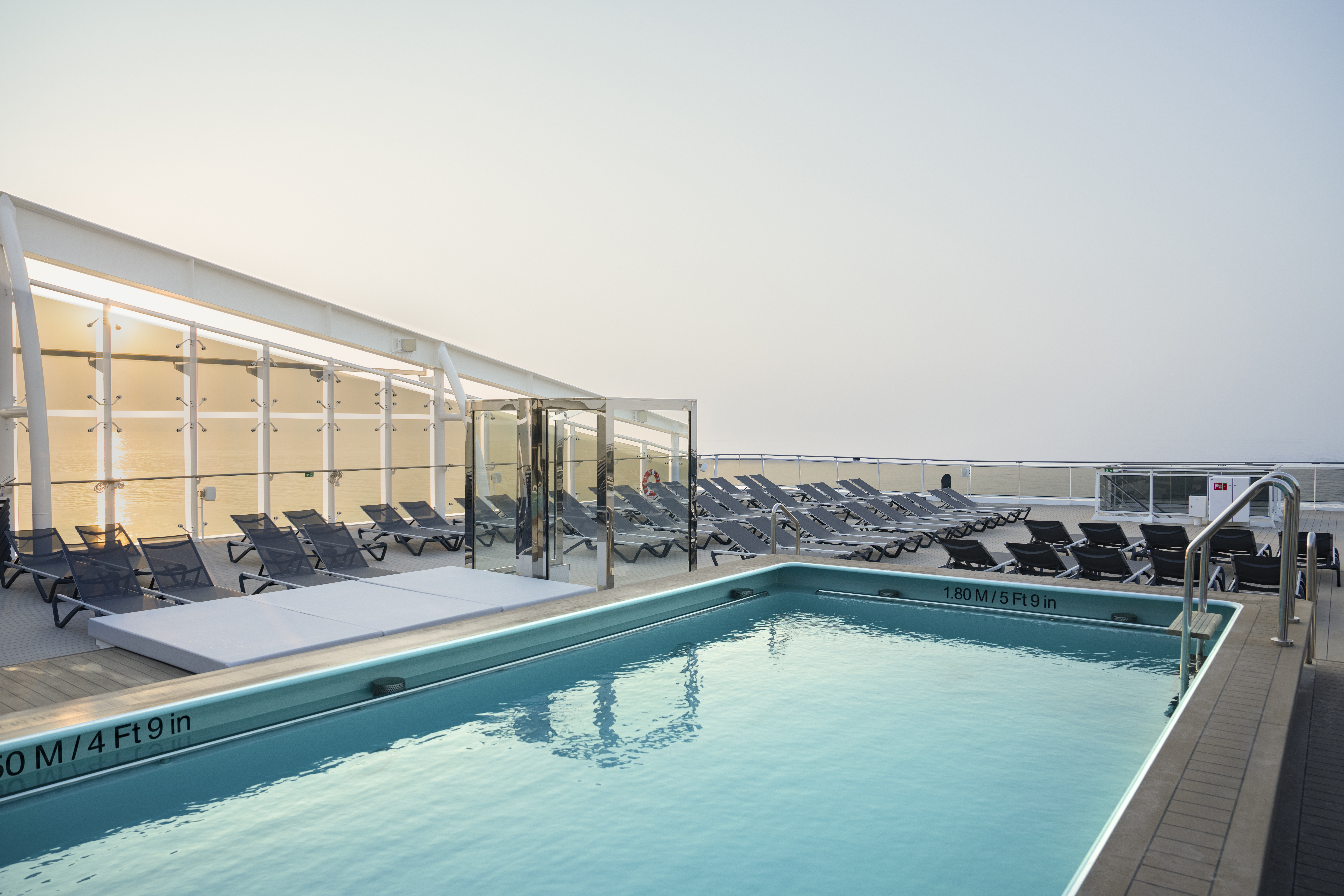 MSC World Europa Zen Pool with lounge chairs and ocean view