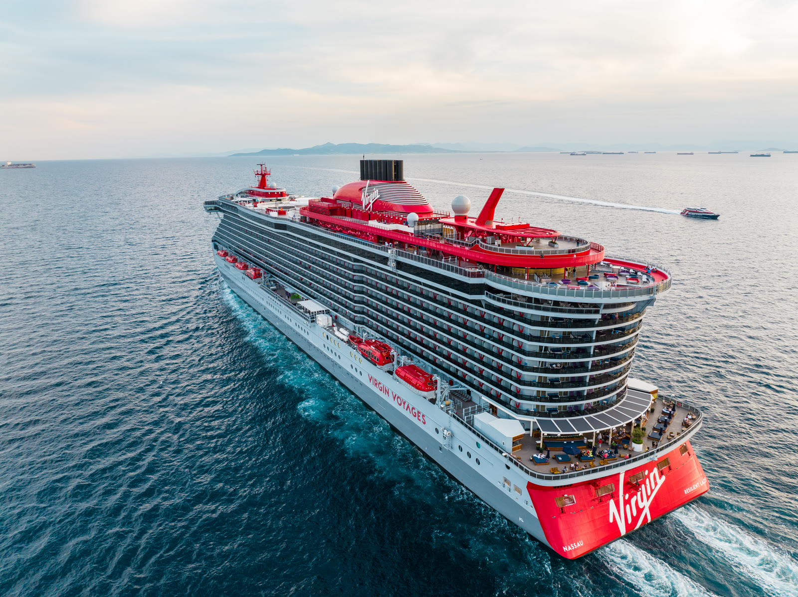 Resilient Lady exterior near Athens, modern Virgin Voyages cruise ship in sun