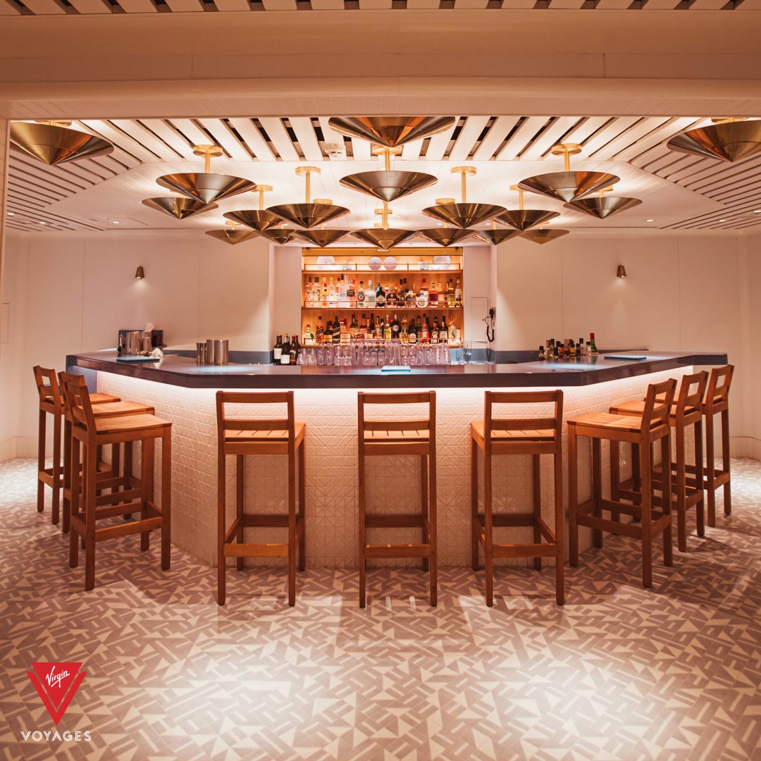 Bright Dock House bar interior with stools and backbar