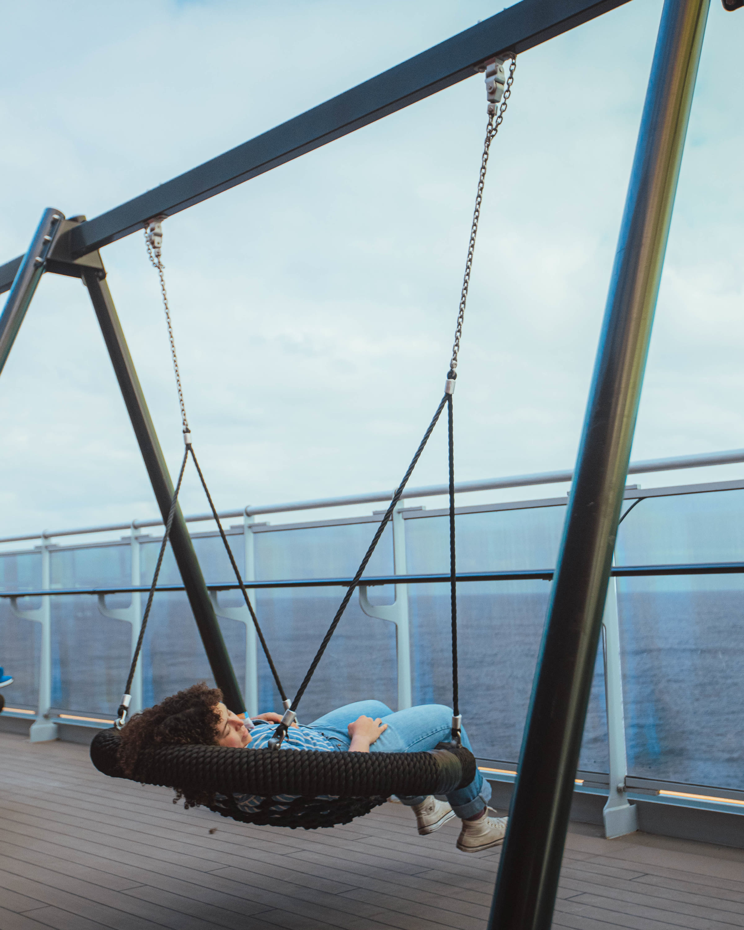 Daylight wellness hammock swing on the ship deck overlooking the sea