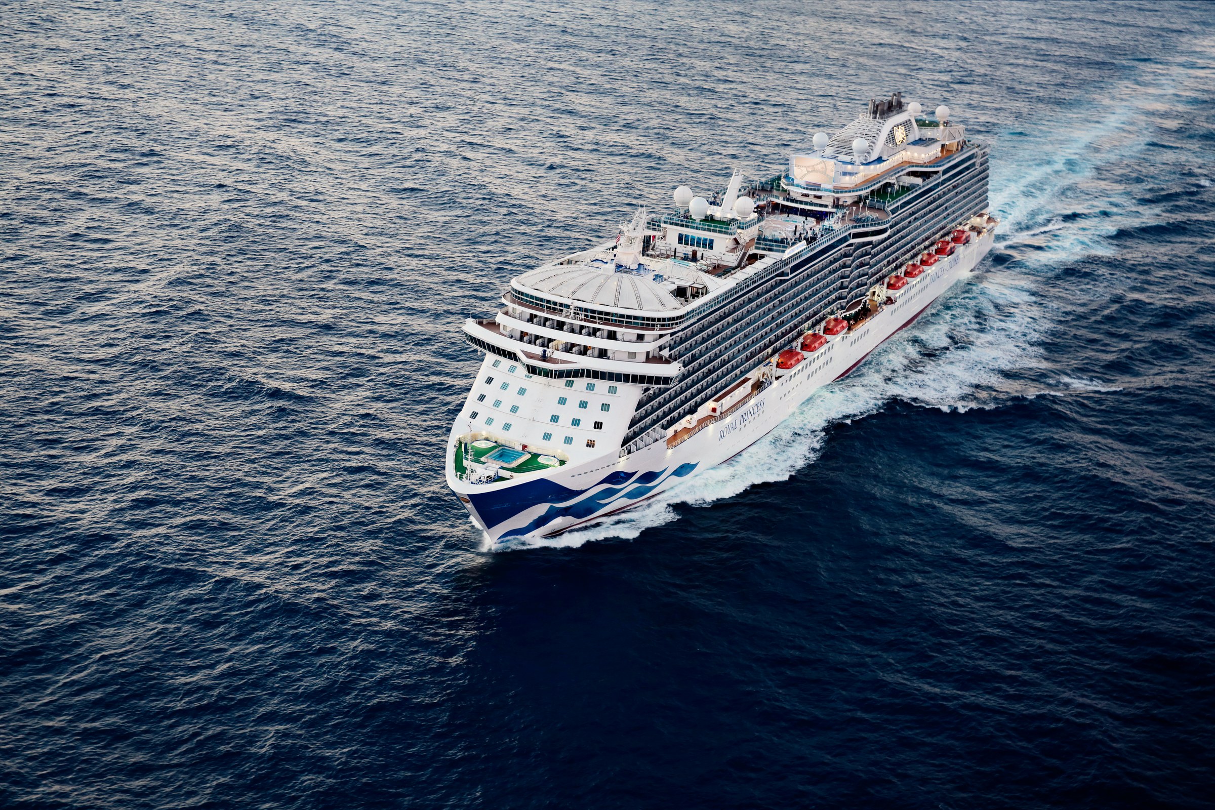 Aerial of Royal Princess at sea in warm light