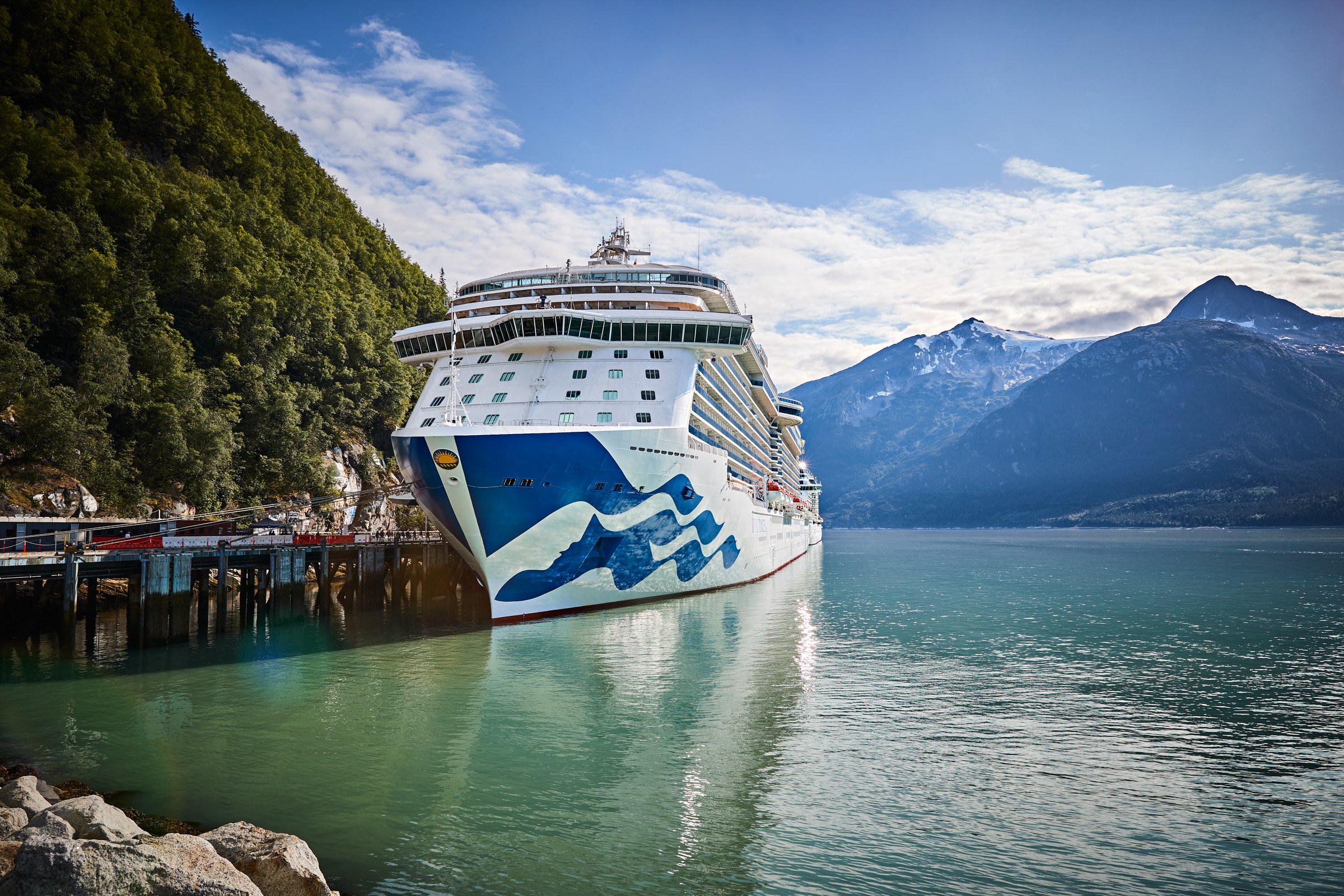 Royal Princess bow at Skagway pier under a bright blue sky