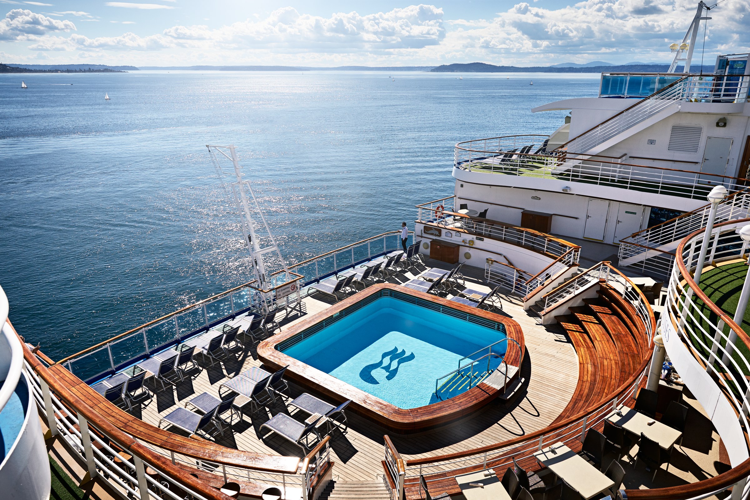 Ruby Princess terrace pool and wooden stadium seating overlooking the sea