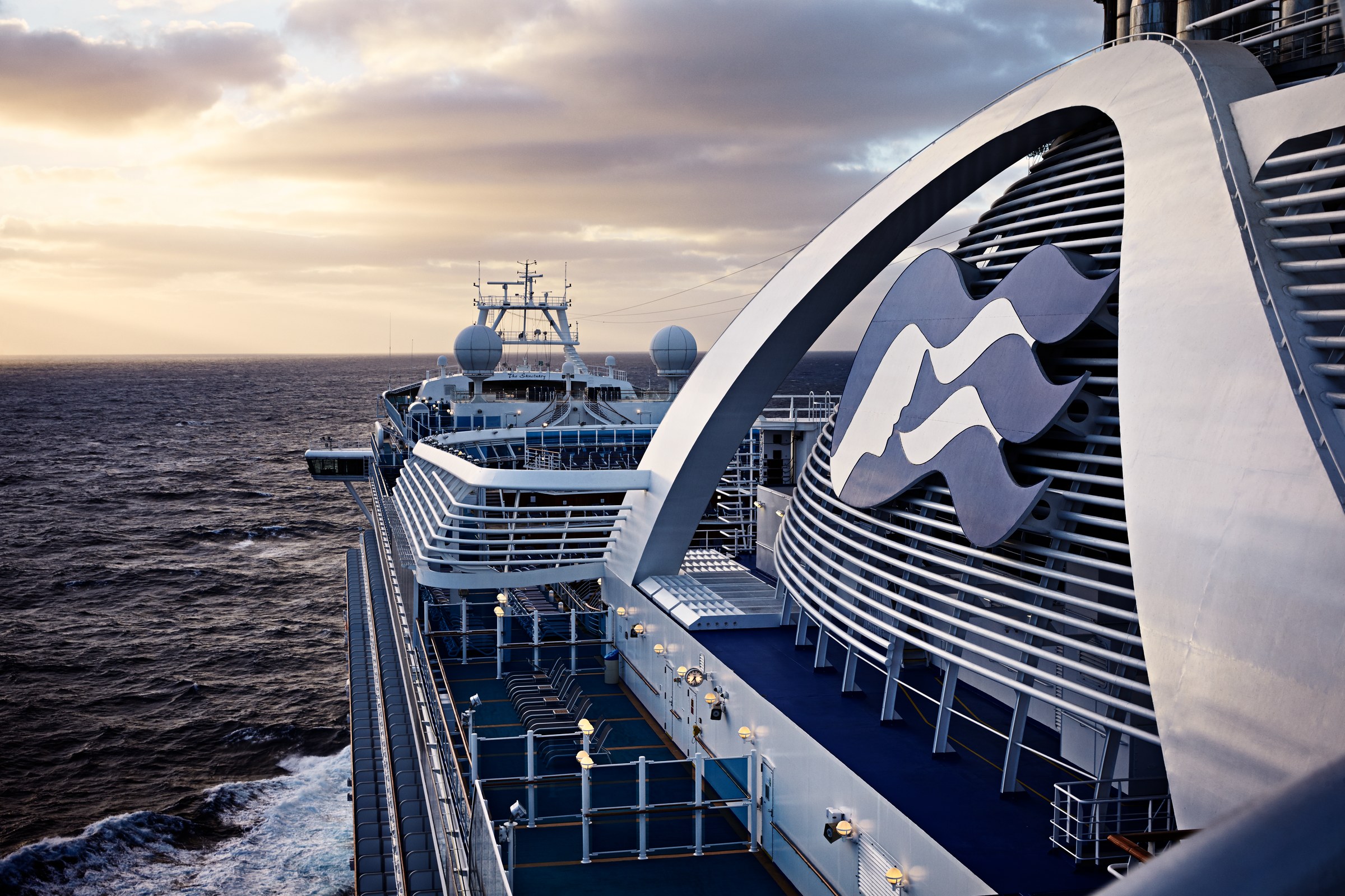 Ruby Princess funnel and decks at sunrise over the ocean