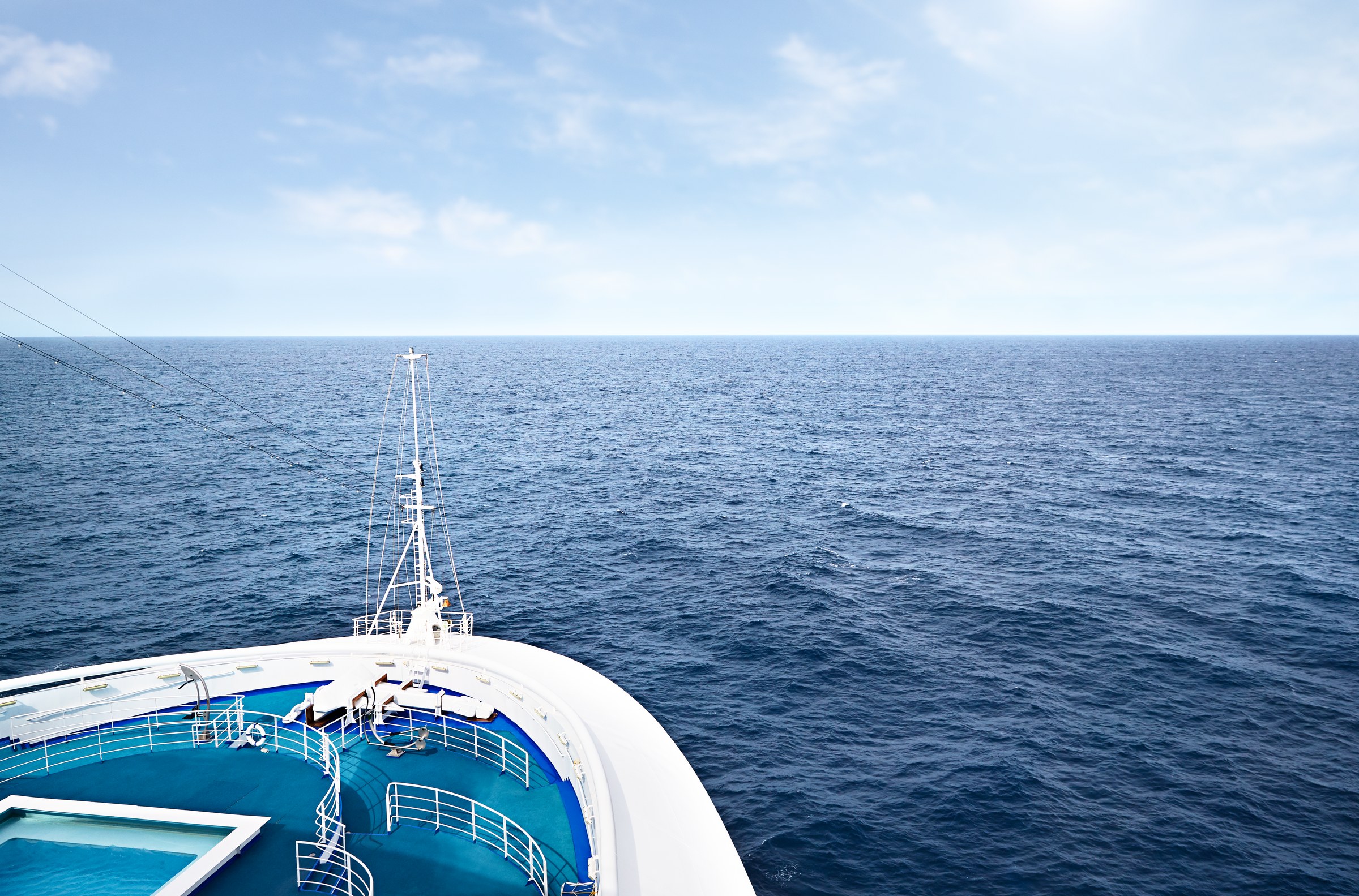 View over Ruby Princess bow toward a calm sunlit sea