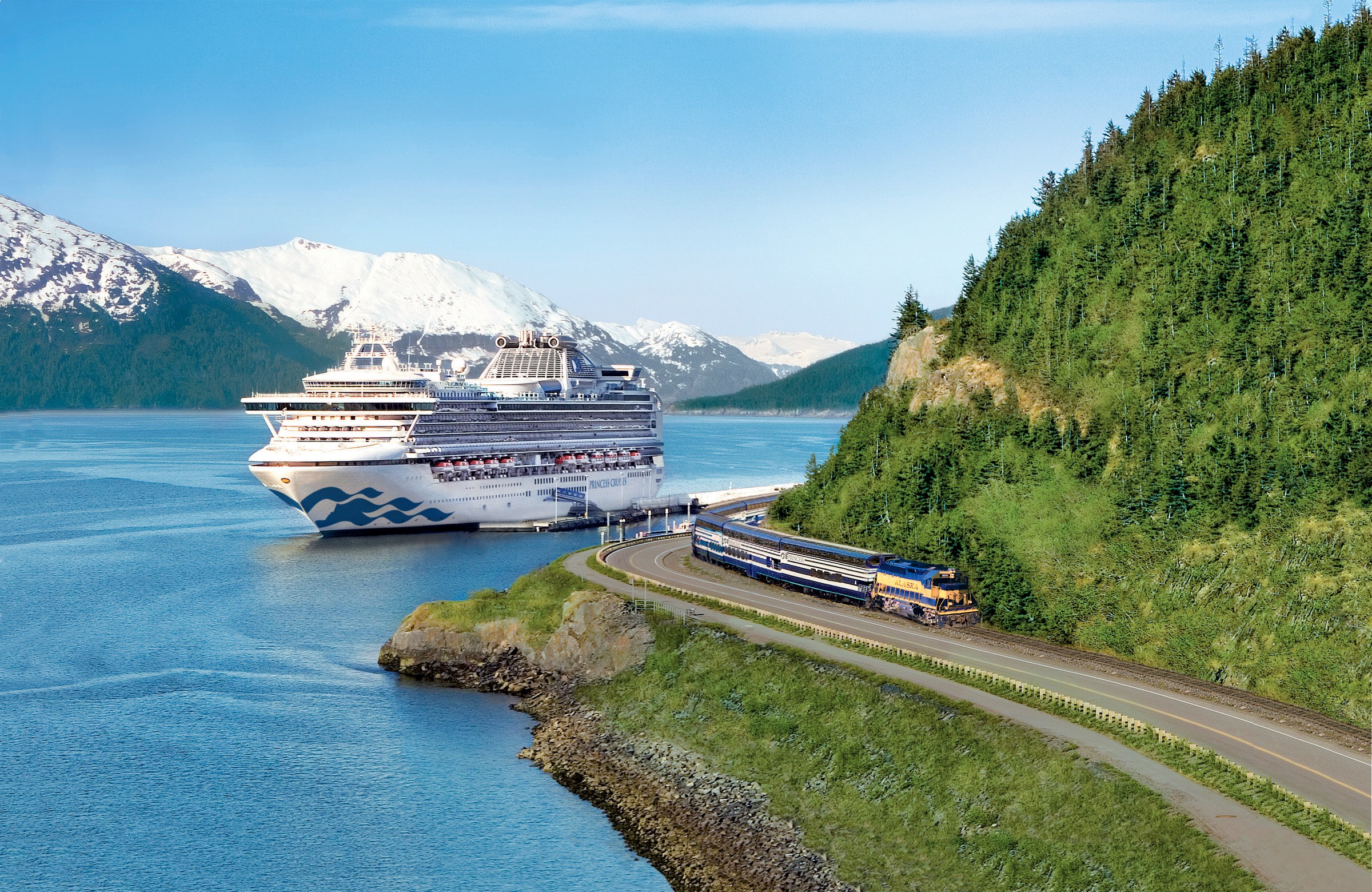 Sapphire Princess docked in Alaska with snowy mountains and Princess rail beside the pier
