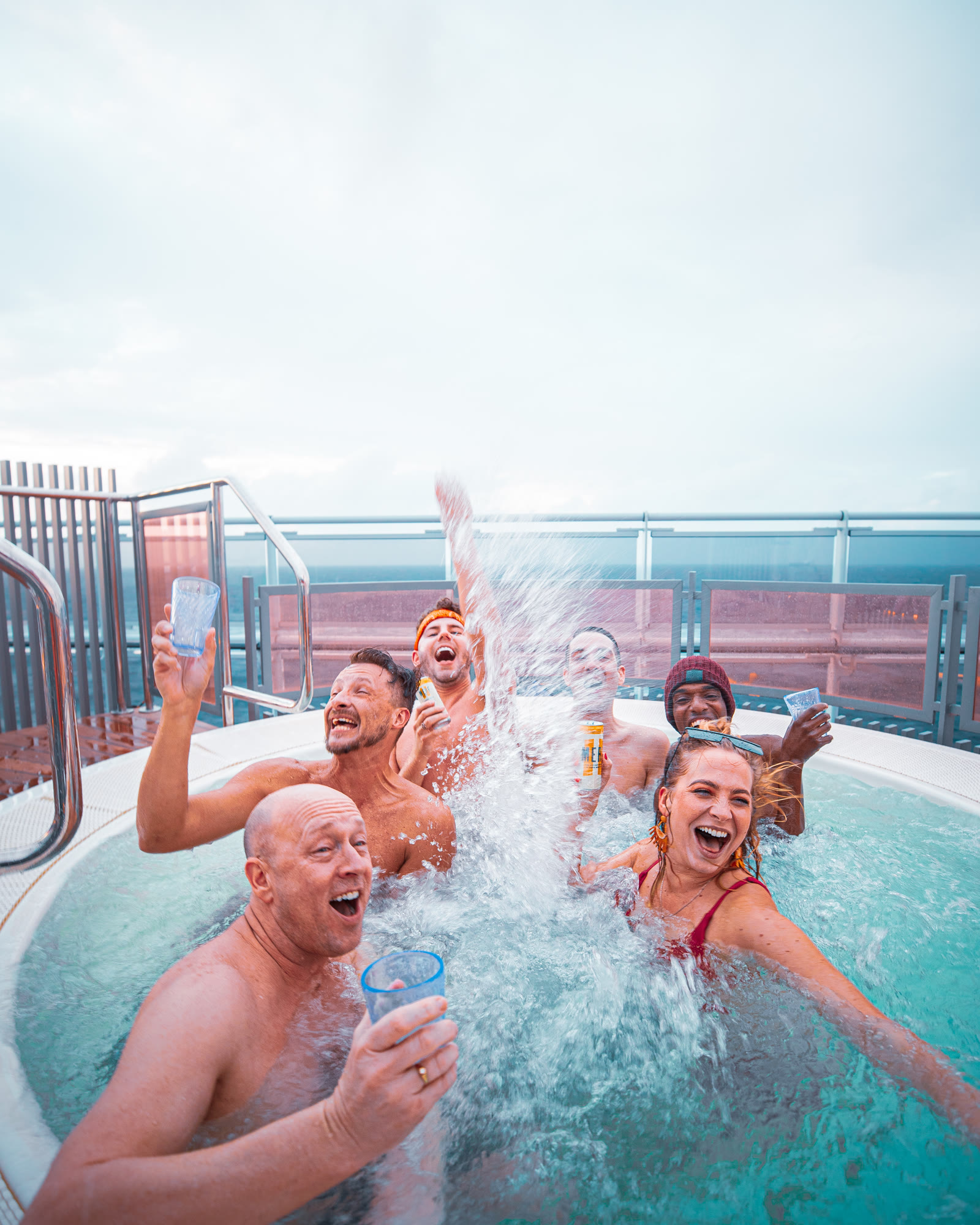 Group of people having a hot tub party.