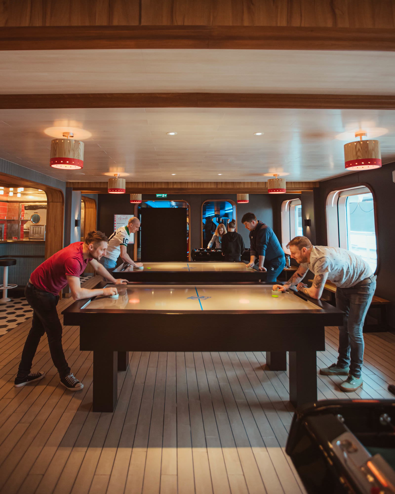 People playing air hockey at The Social Club.