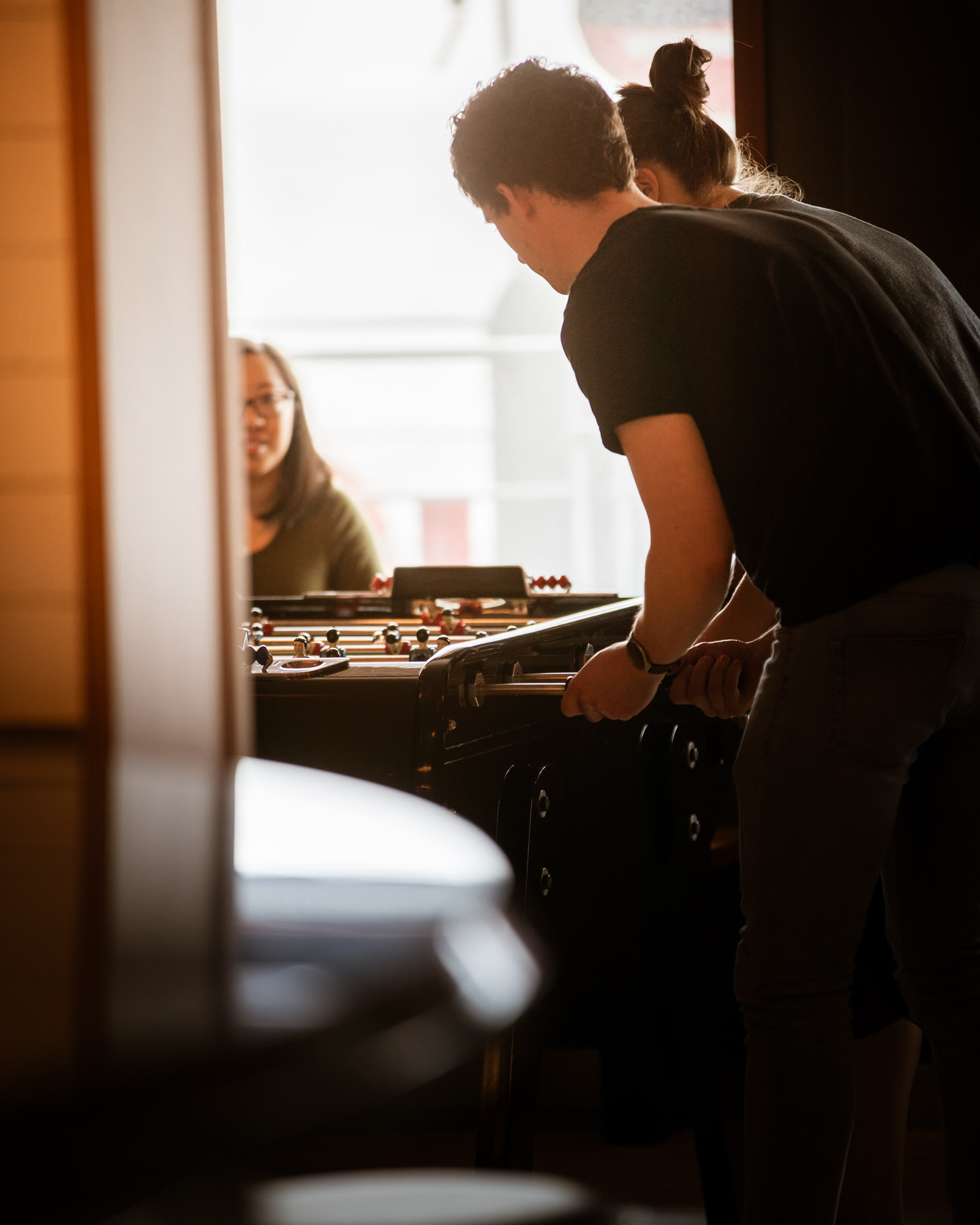People playing foosball at The Social Club.