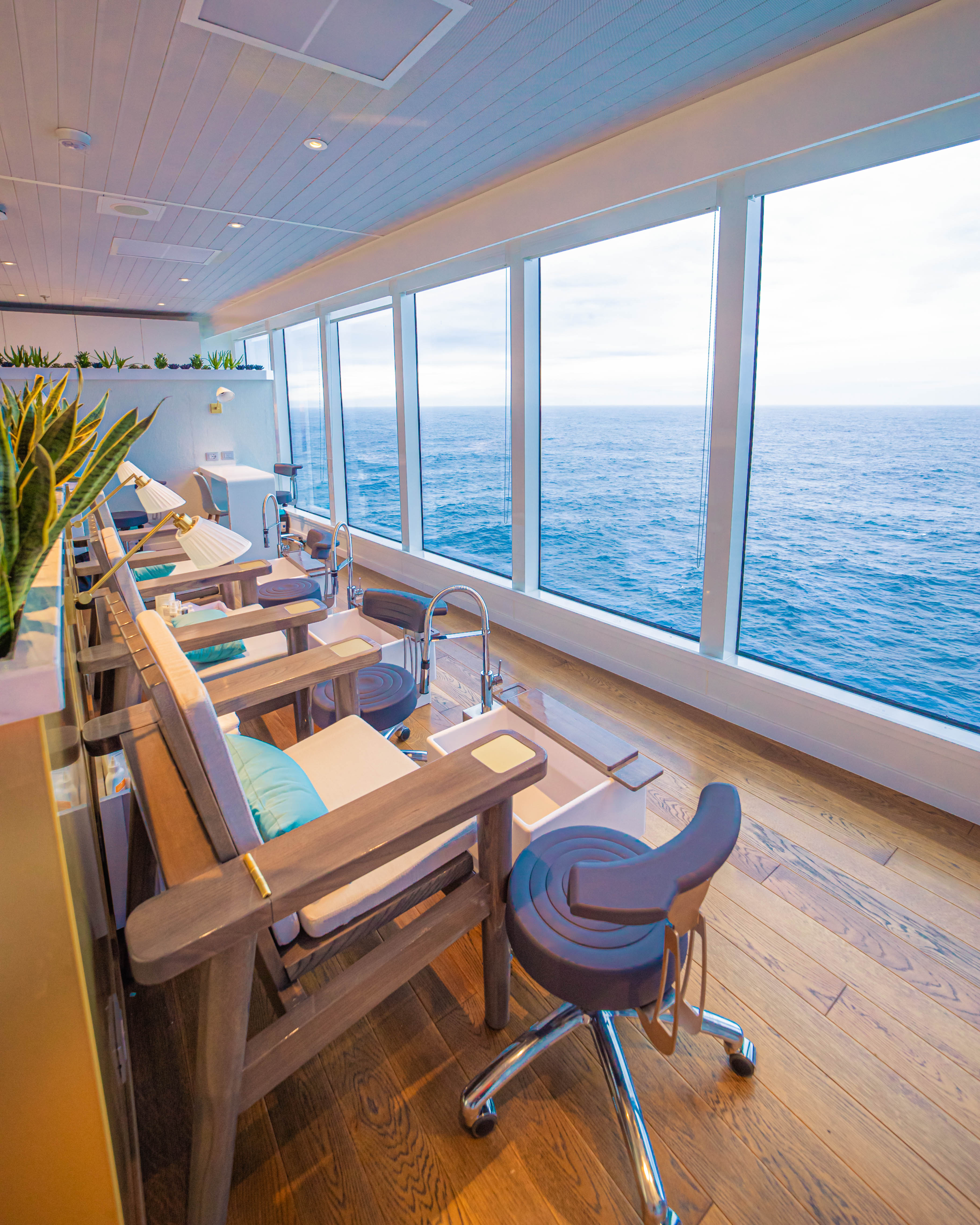 The Tune Up nail salon with ocean views through bright windows.