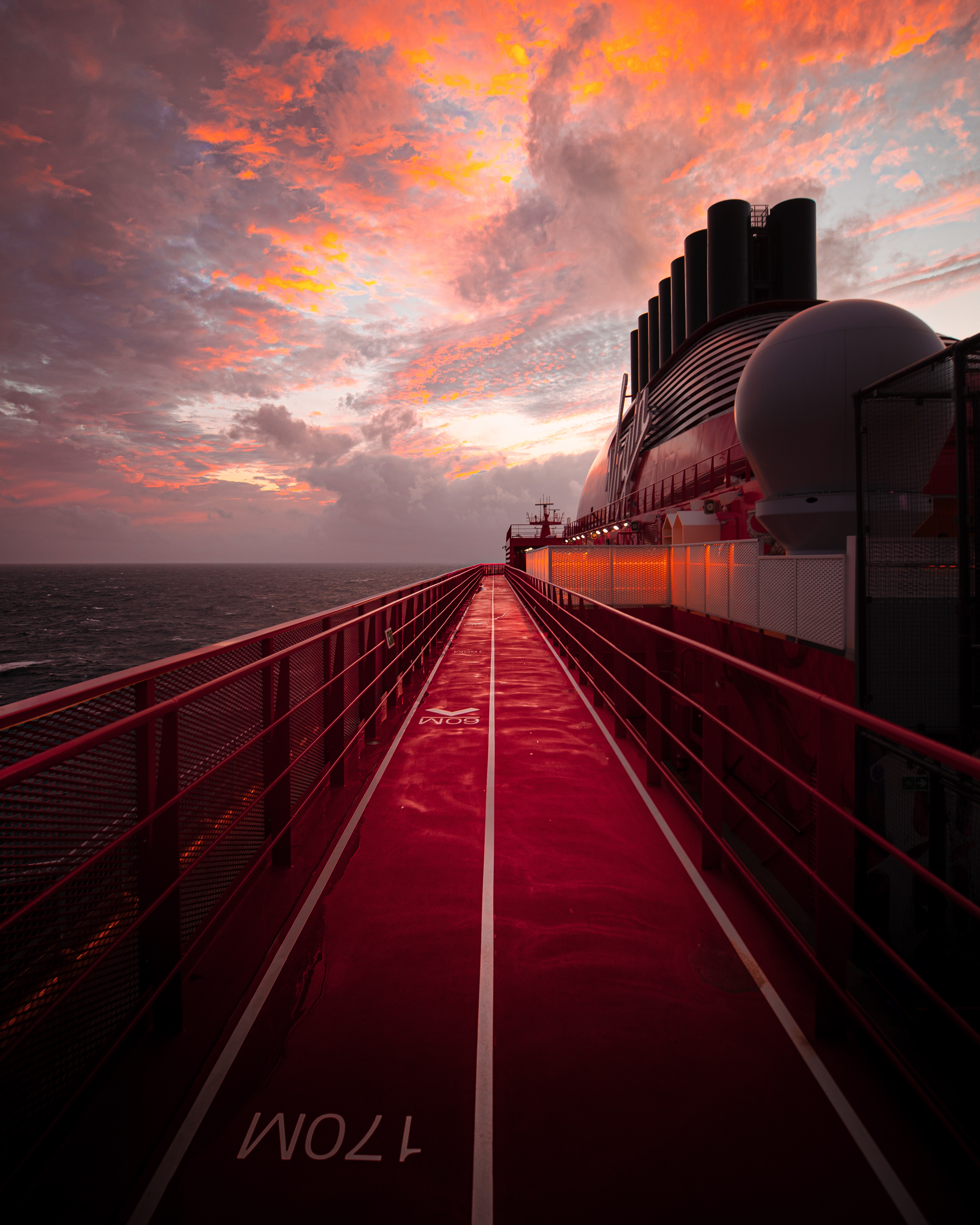 Runner on The Runway red outdoor track.