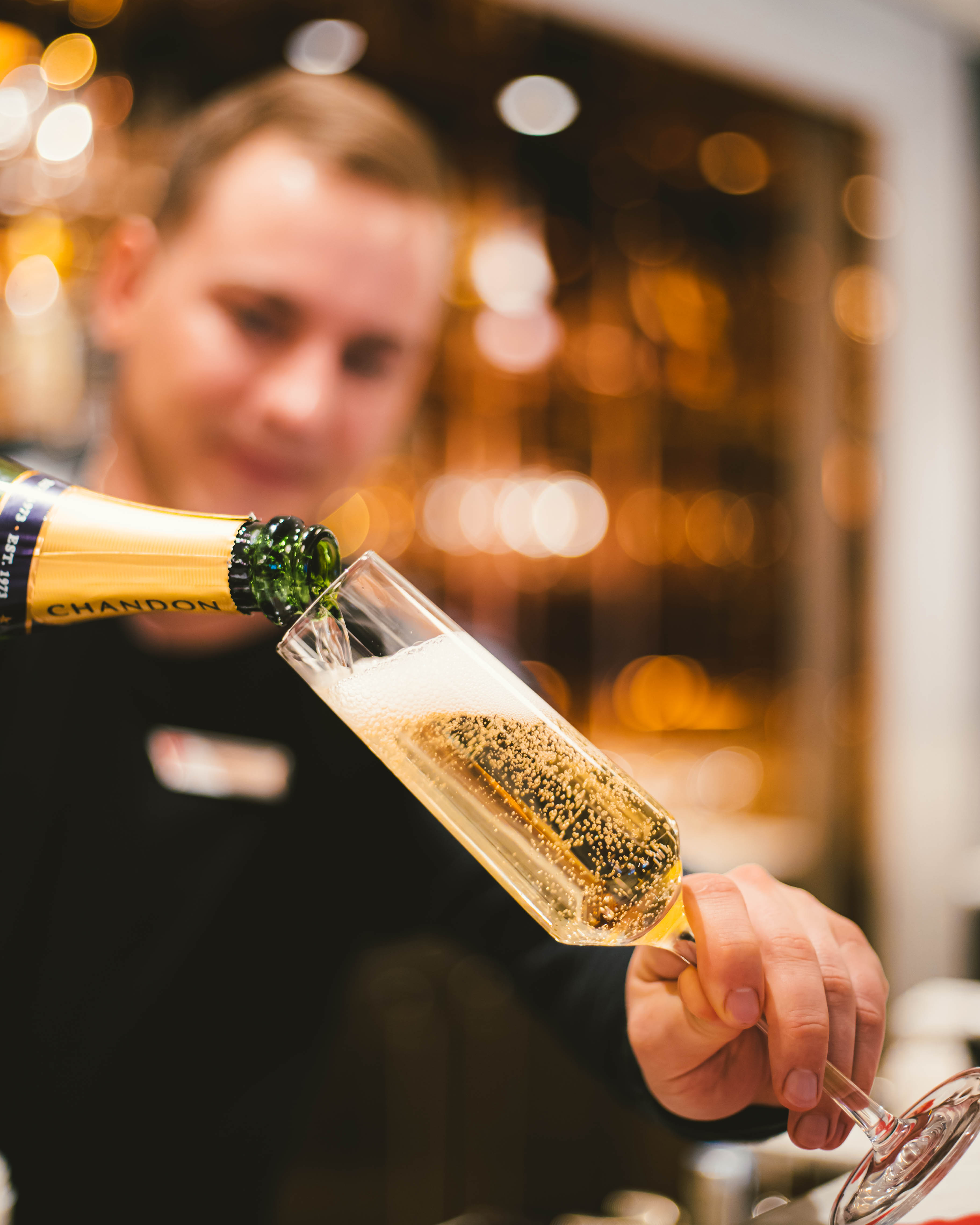 Champagne being poured into a flute at Sip Lounge.