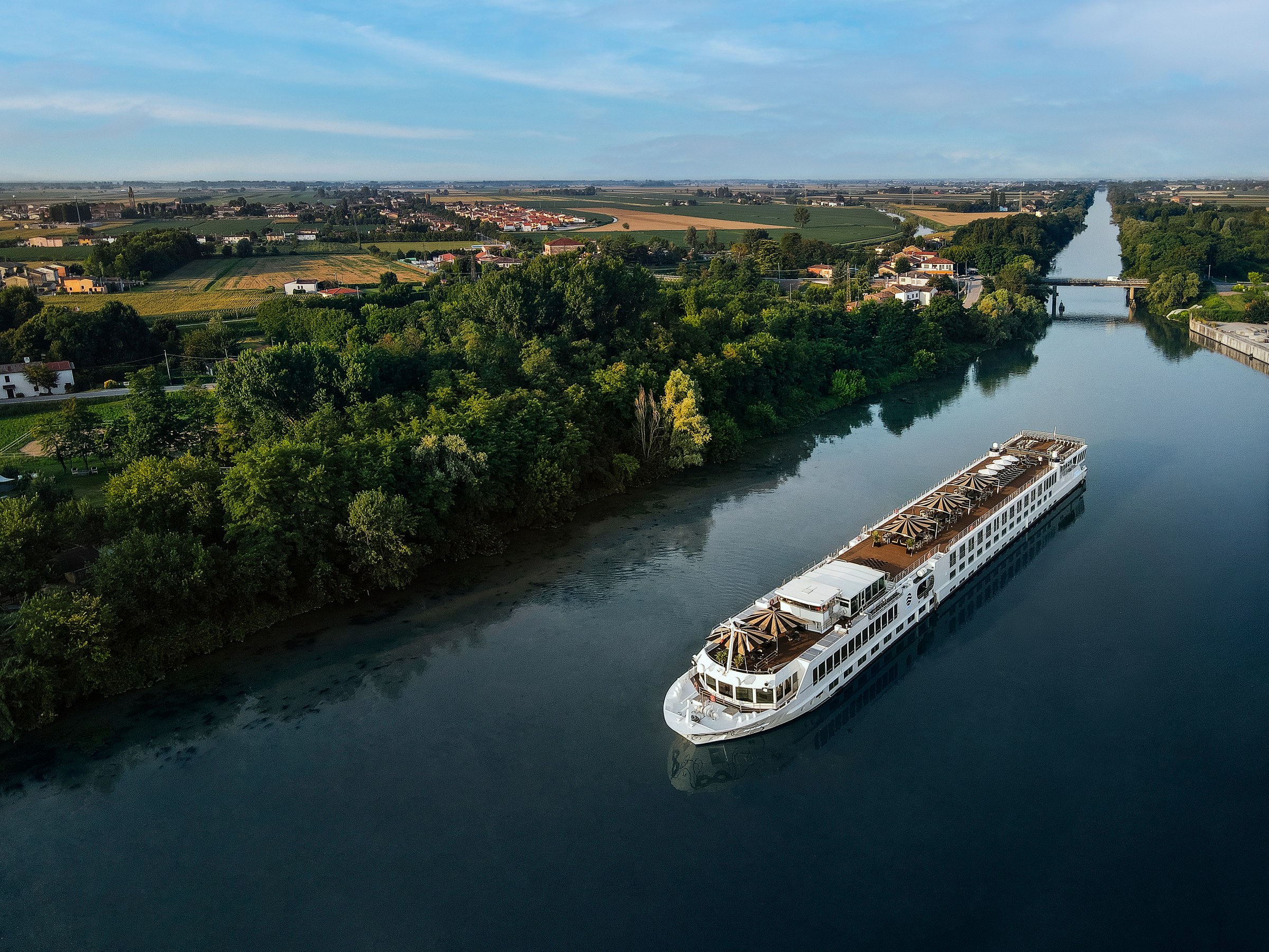S.S. La Venezia – sailing a river, aerial view