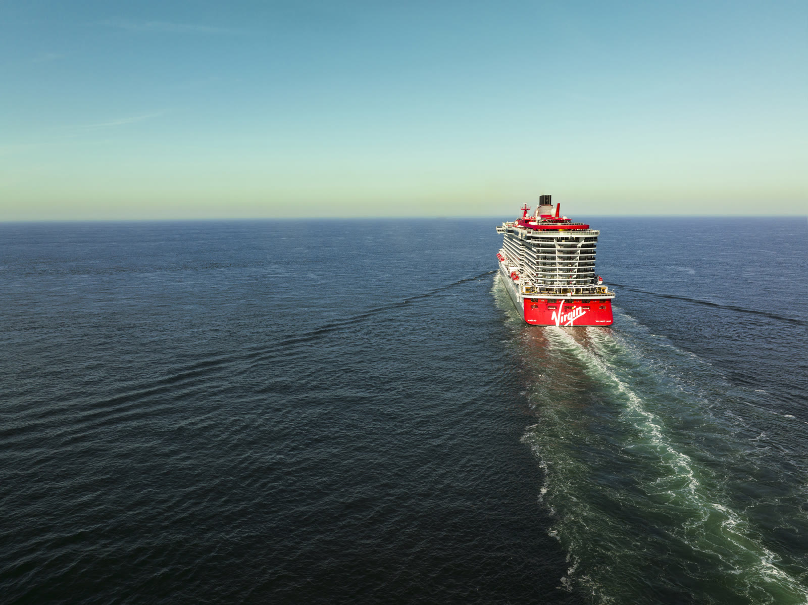 Valiant Lady sailing far away on blue water